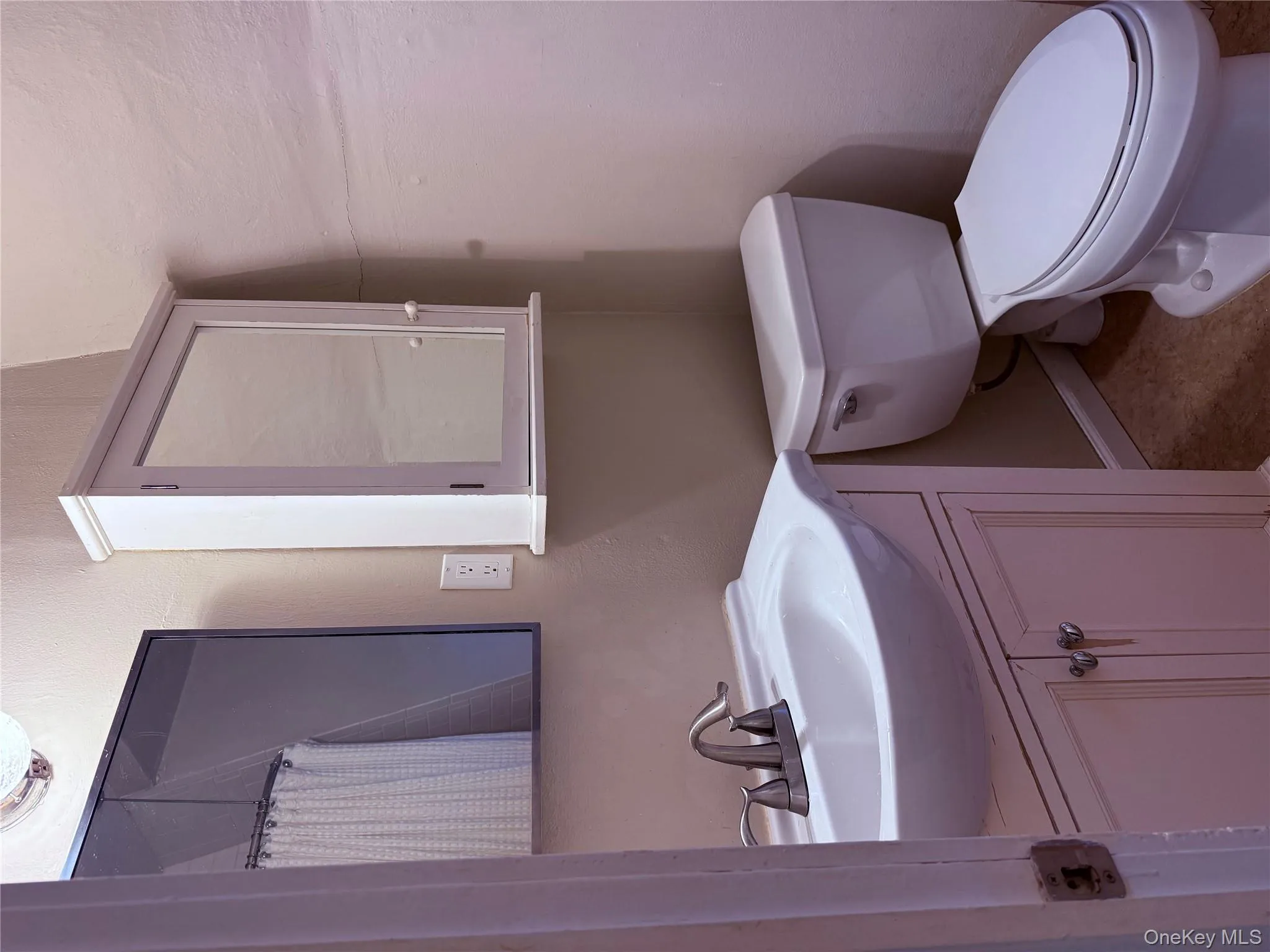 Full bathroom with a shower, and vanity sink. Full bathroom with a shower, and vanity sink.