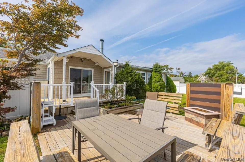 Deck with outdoor dining area and an outdoor fire pit Deck with outdoor dining area and an outdoor fire pit