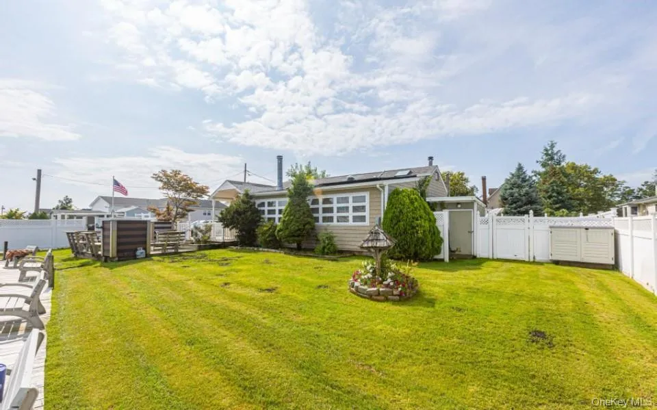 Fenced backyard with a gate Fenced backyard with a gate