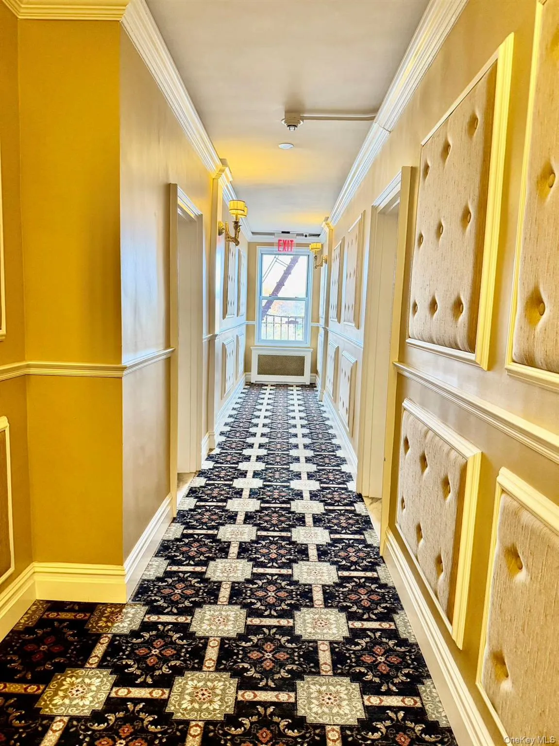 Hall featuring ornamental molding Hall featuring ornamental molding