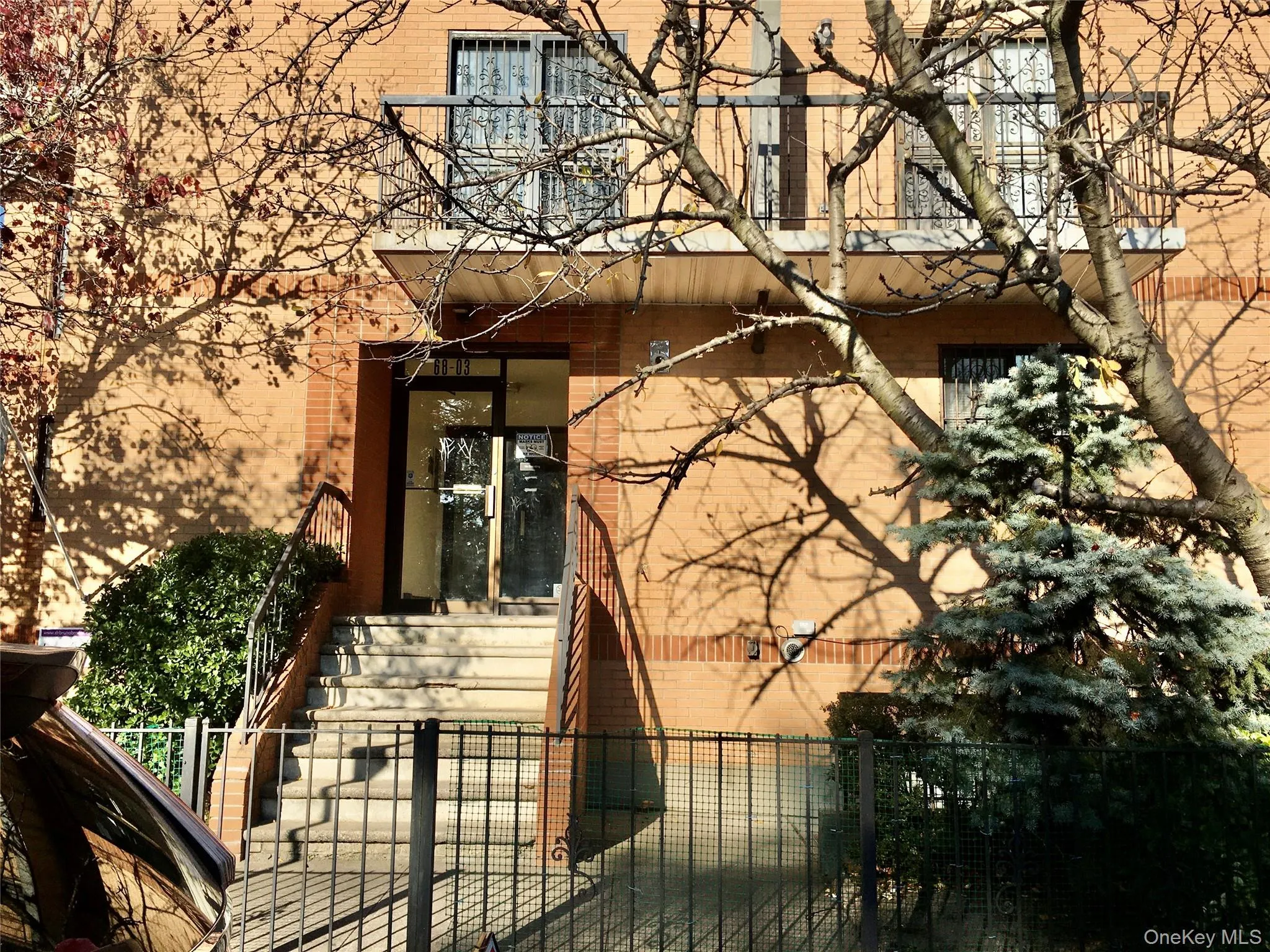 Property entrance featuring brick siding Property entrance featuring brick siding