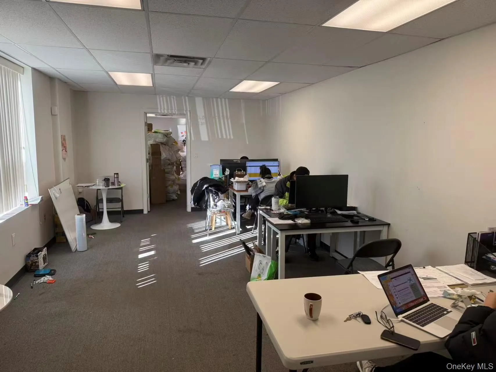 Office space with a paneled ceiling Office space with a paneled ceiling