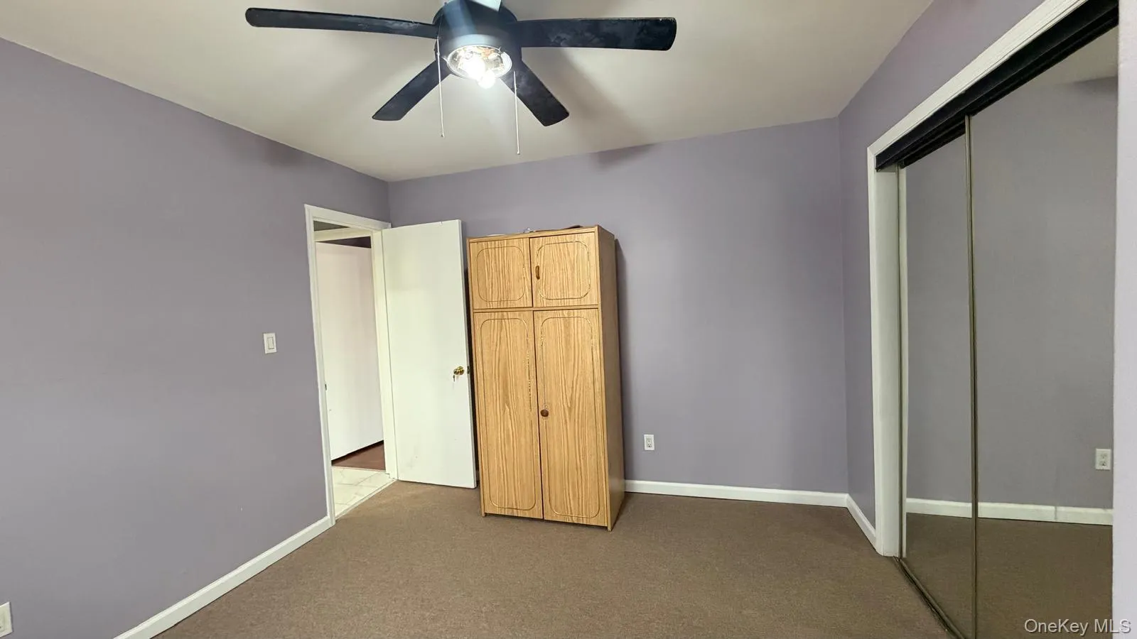 Unfurnished bedroom featuring a closet, carpet flooring, and a ceiling fan Unfurnished bedroom featuring a closet, carpet flooring, and a ceiling fan