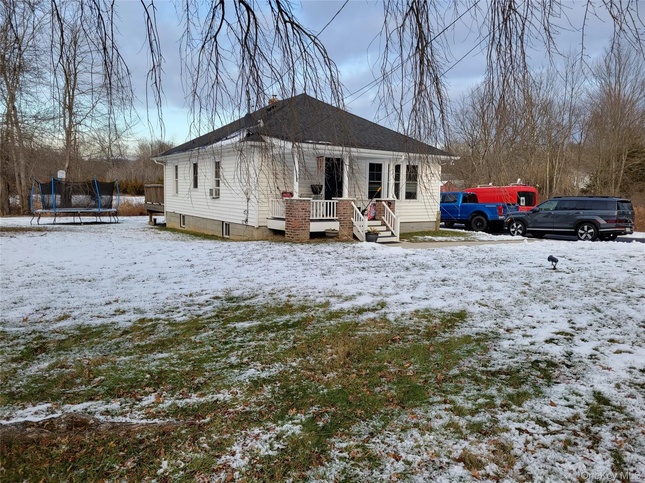 View of front of house with a trampoline and a deck View of front of house with a trampoline and a deck