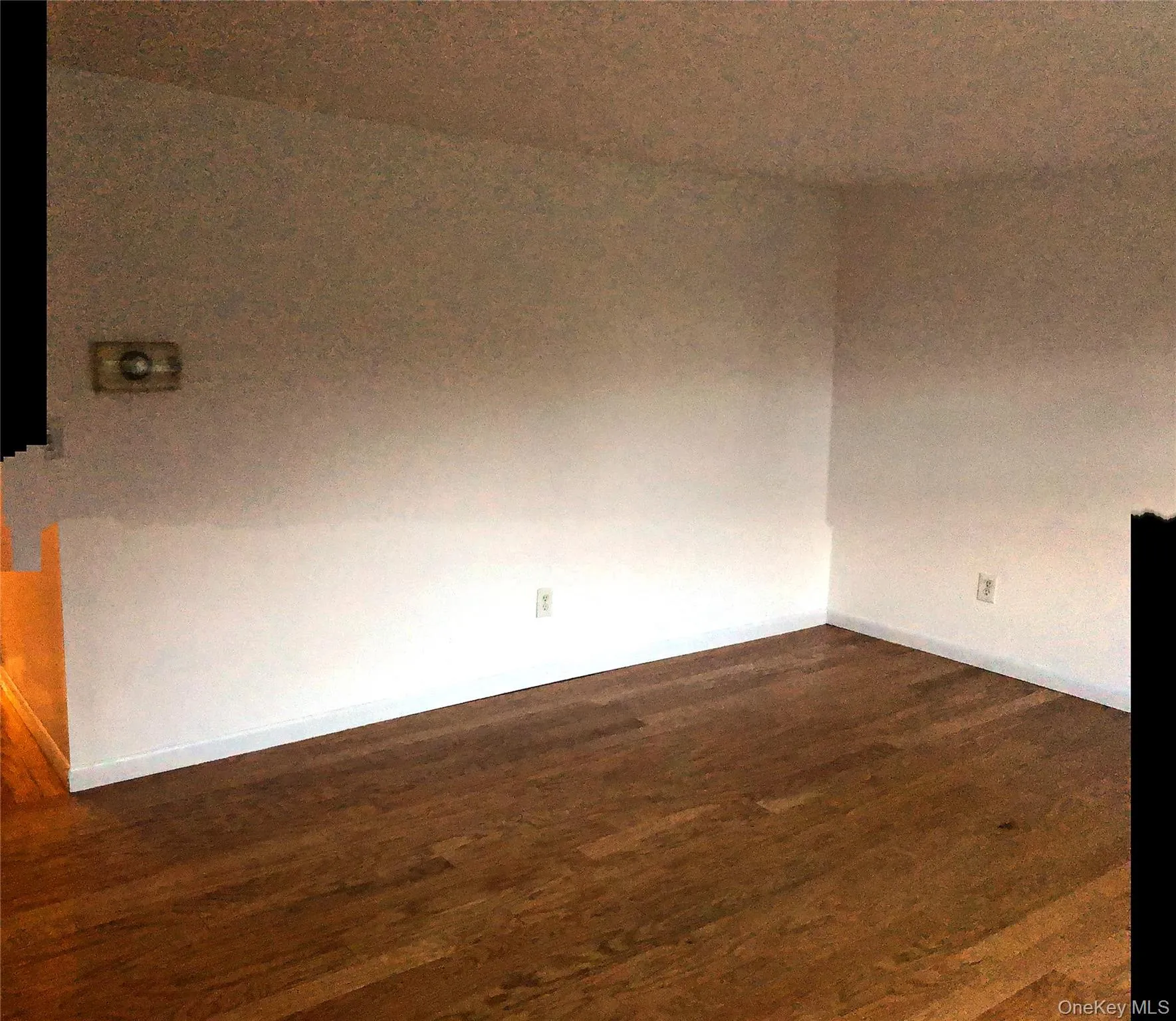 Unfurnished room with dark wood-type flooring Unfurnished room with dark wood-type flooring