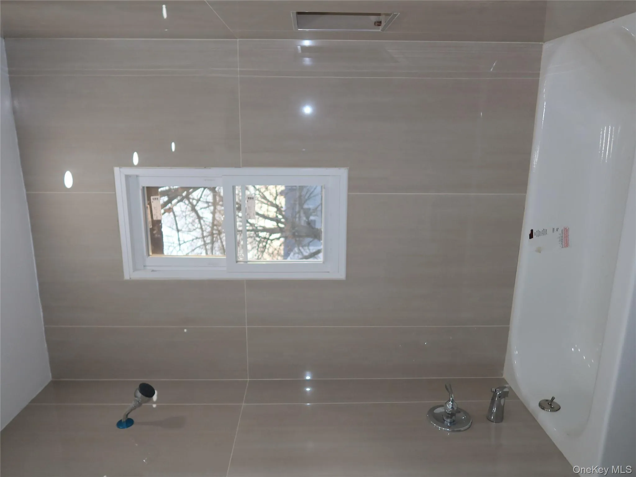 Bathroom featuring shower combination Bathroom featuring shower combination