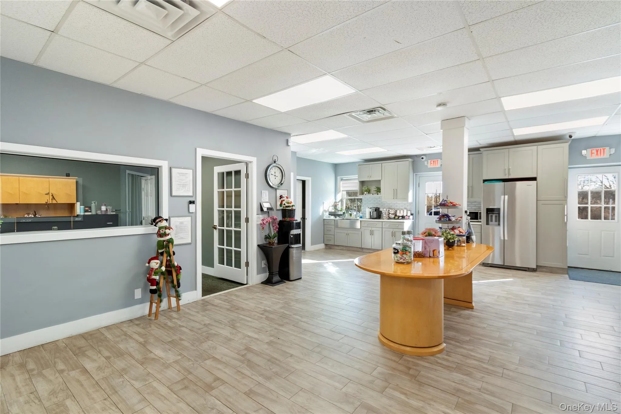 Reception area featuring a drop ceiling Reception area featuring a drop ceiling