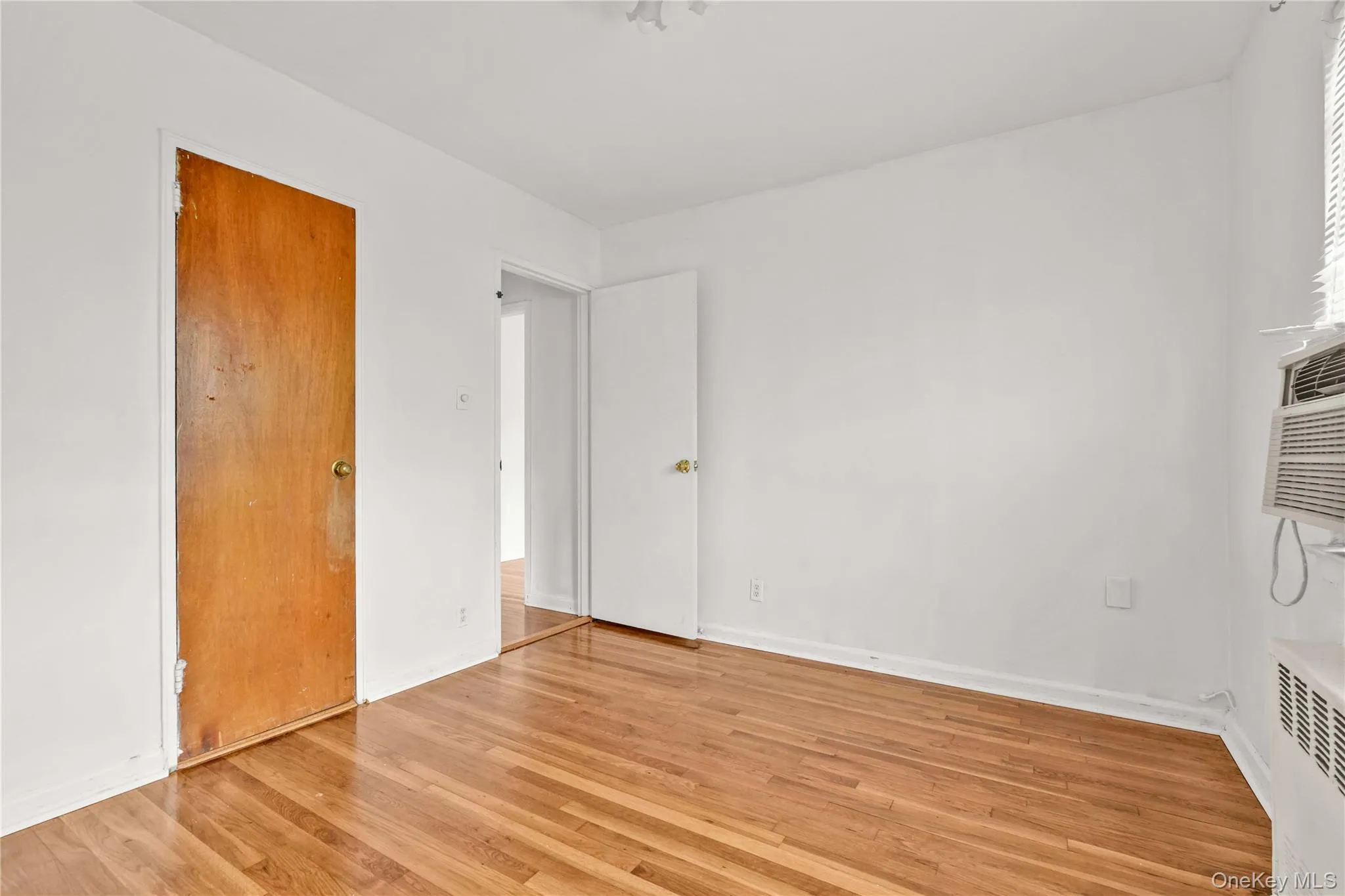 Unfurnished bedroom featuring light wood-style floors Unfurnished bedroom featuring light wood-style floors