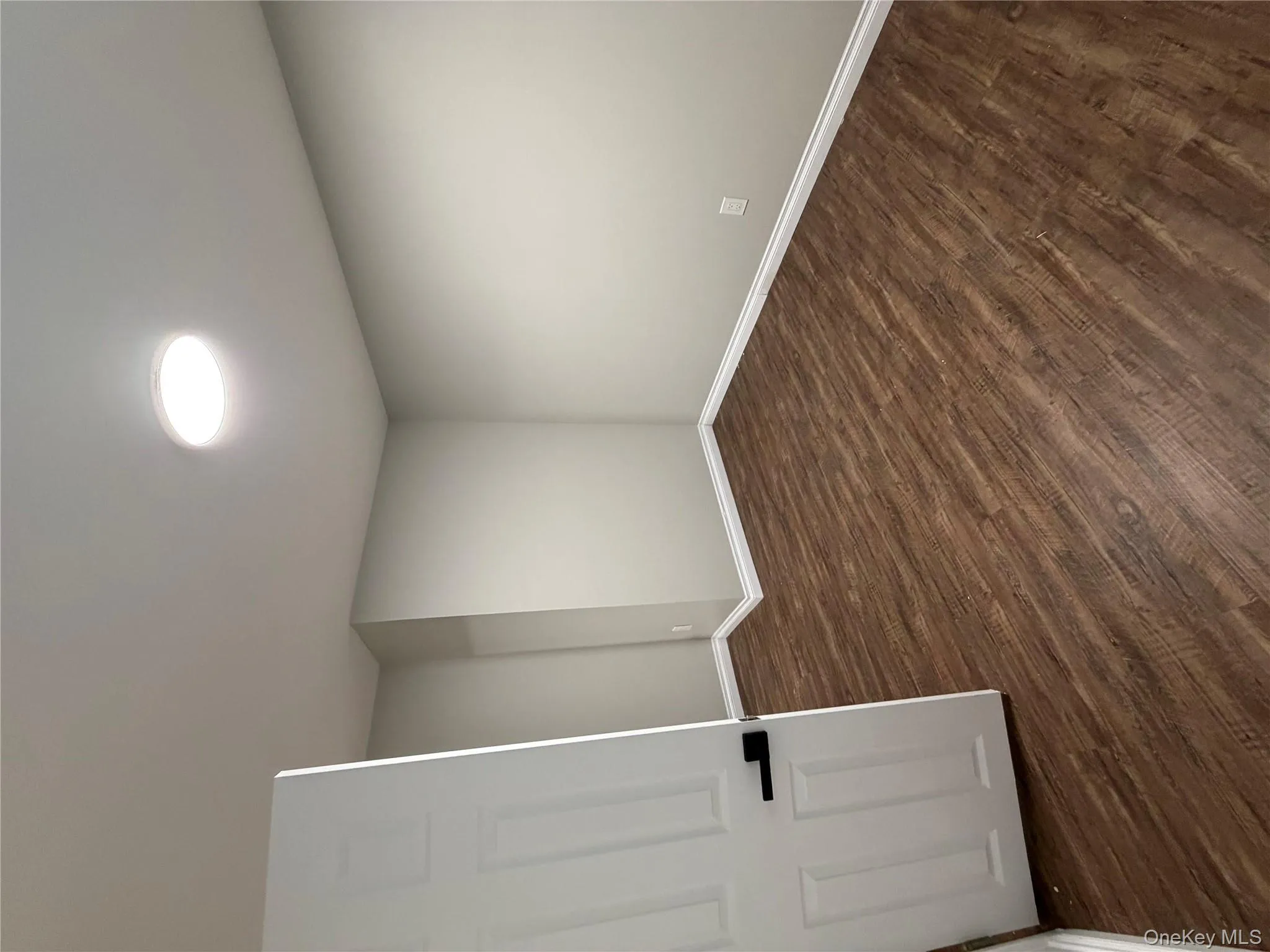 Spare room with dark wood-style floors Spare room with dark wood-style floors