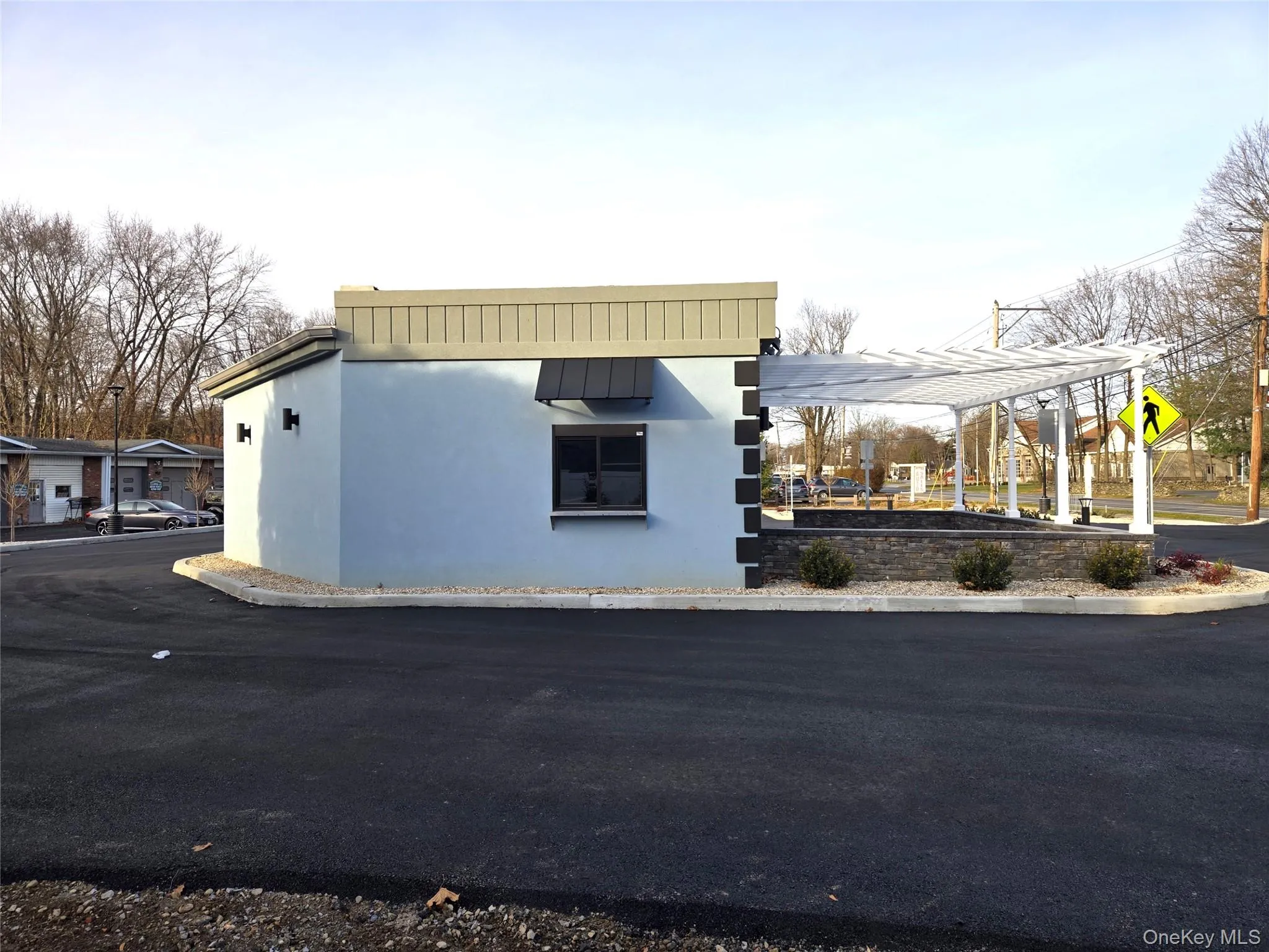 View of property exterior with stucco siding View of property exterior with stucco siding