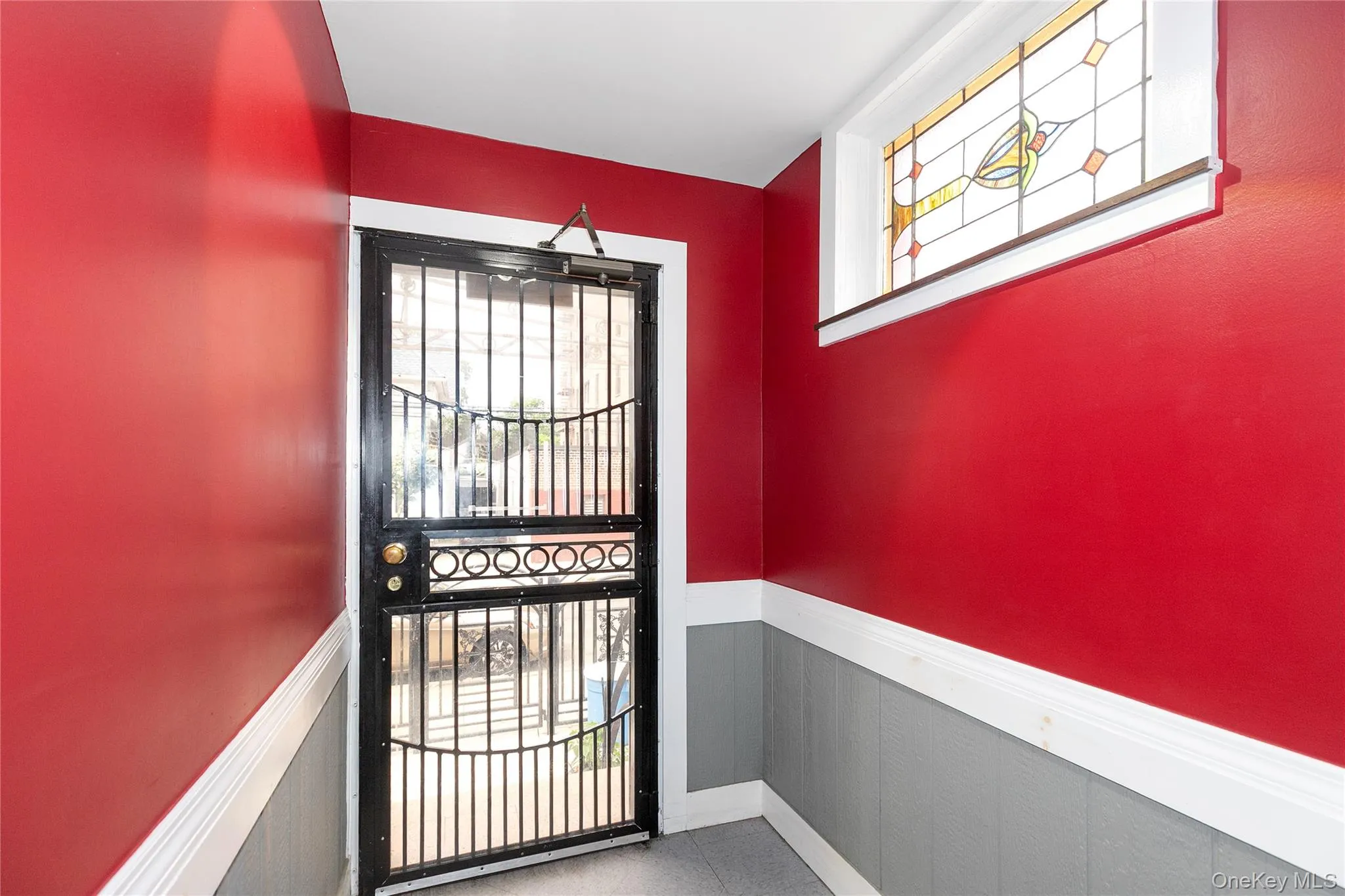 Entryway featuring a wainscoted wall and healthy amount of natural light Entryway featuring a wainscoted wall and healthy amount of natural light