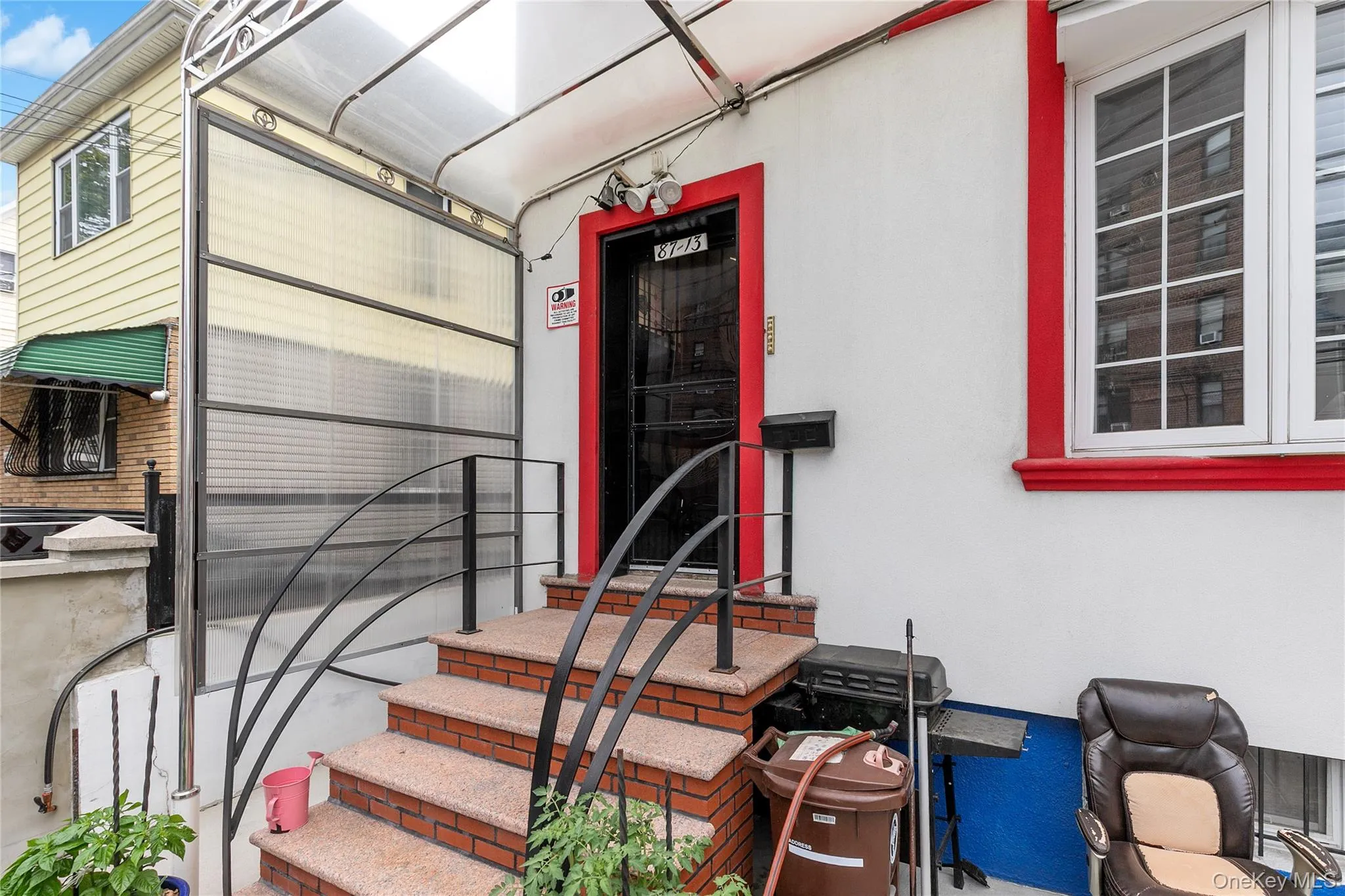 Doorway to property featuring stucco siding Doorway to property featuring stucco siding