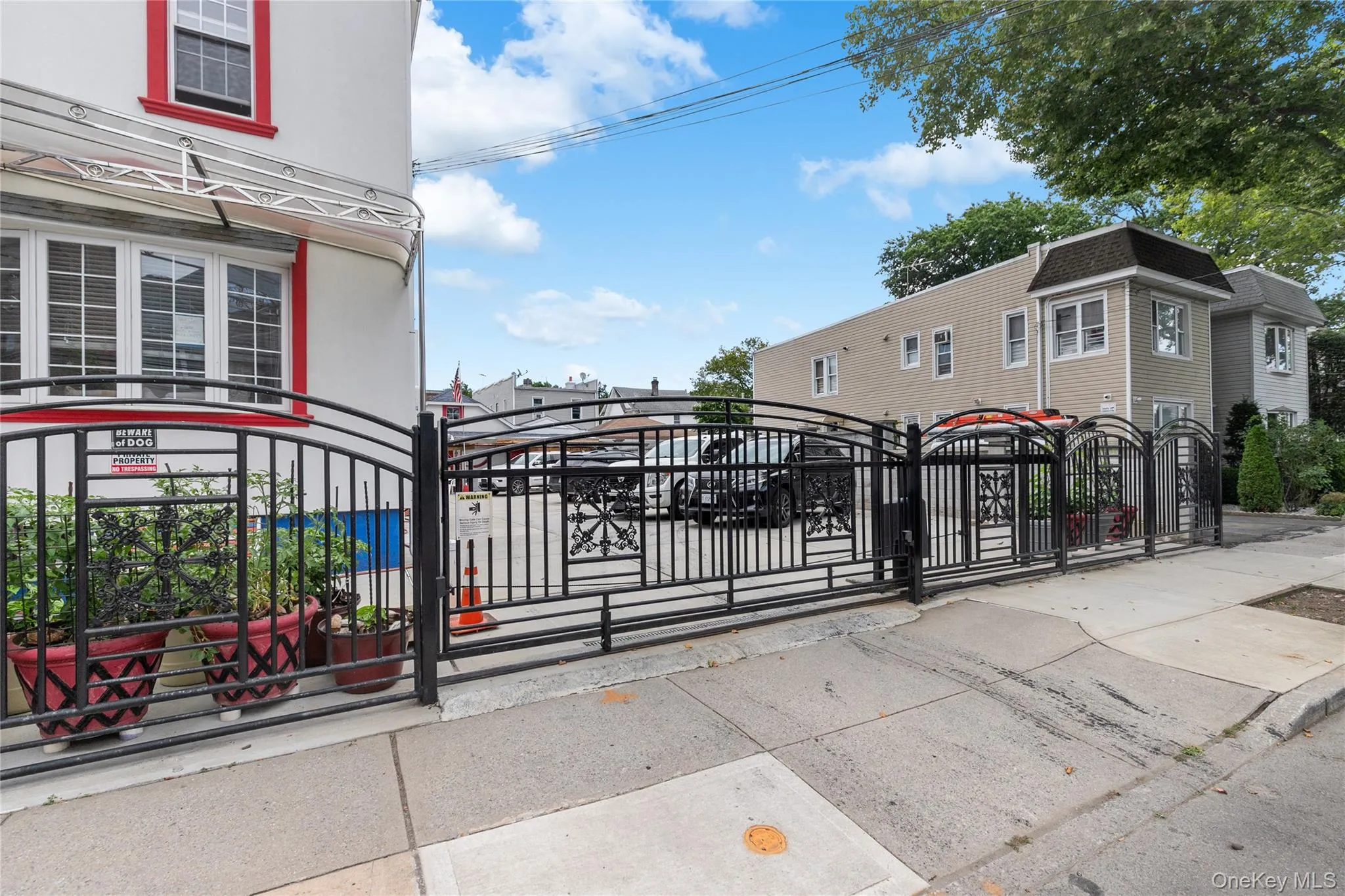Electronic Gate featuring a fenced front yard Electronic Gate featuring a fenced front yard