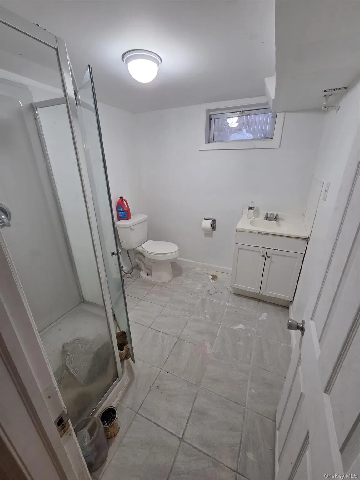 Bathroom with vanity and a shower stall Bathroom with vanity and a shower stall