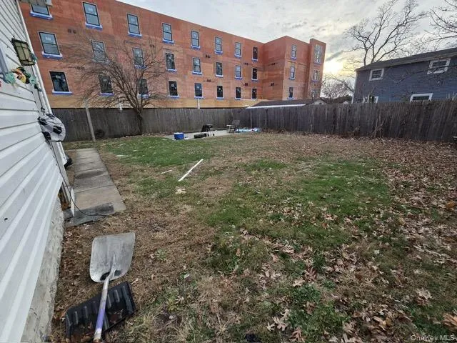 Fenced backyard featuring a patio area Fenced backyard featuring a patio area