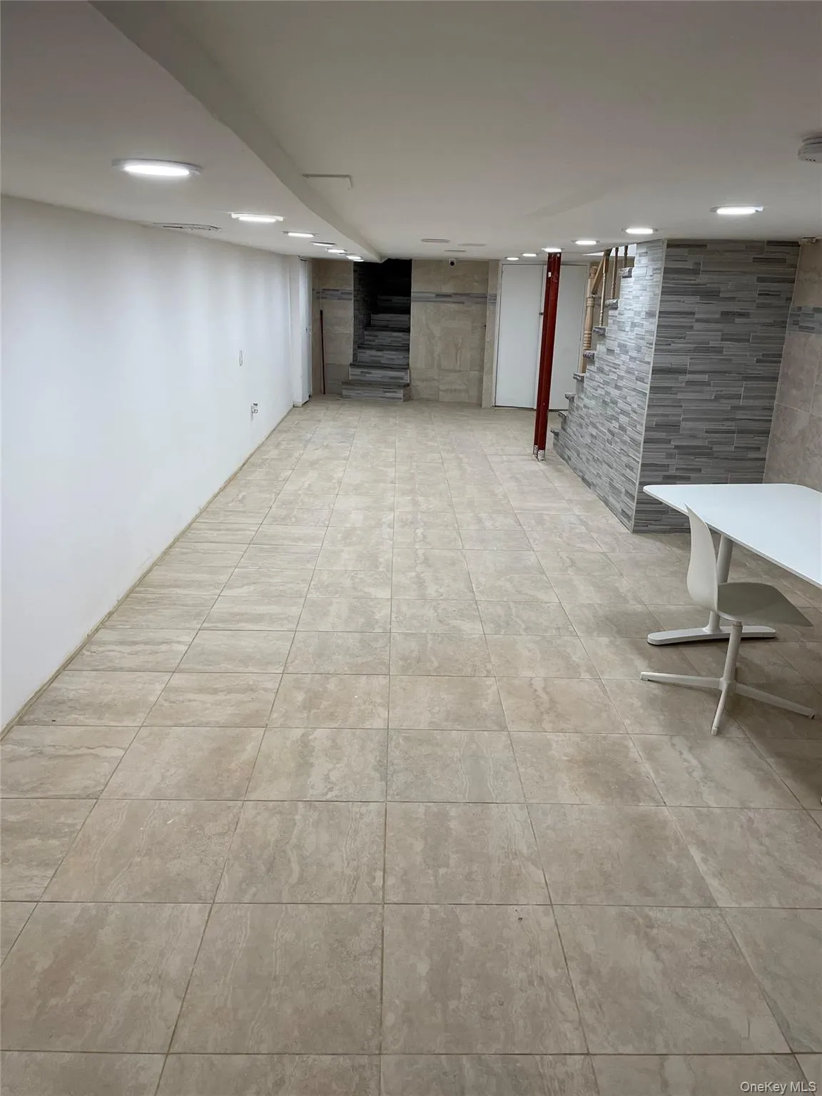 Finished below grade area with stairway Finished below grade area with stairway