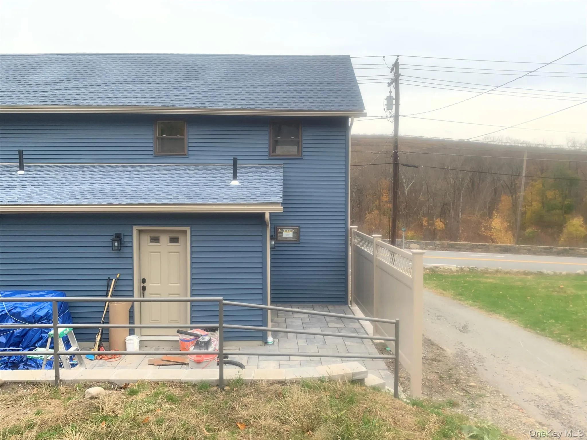 View of front facade with a shingled roof View of front facade with a shingled roof