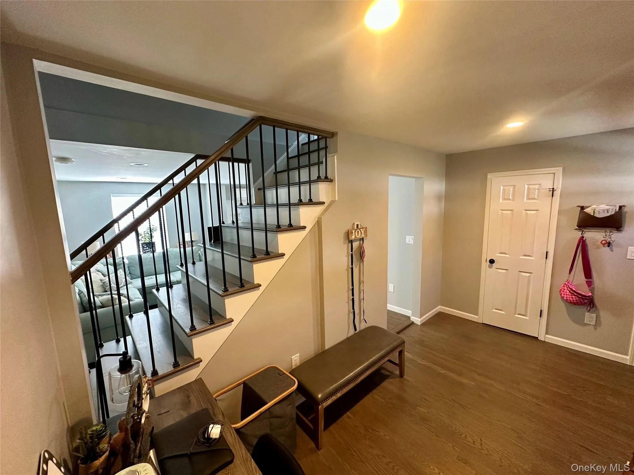 Stairway featuring wood finished floors and recessed lighting Stairway featuring wood finished floors and recessed lighting