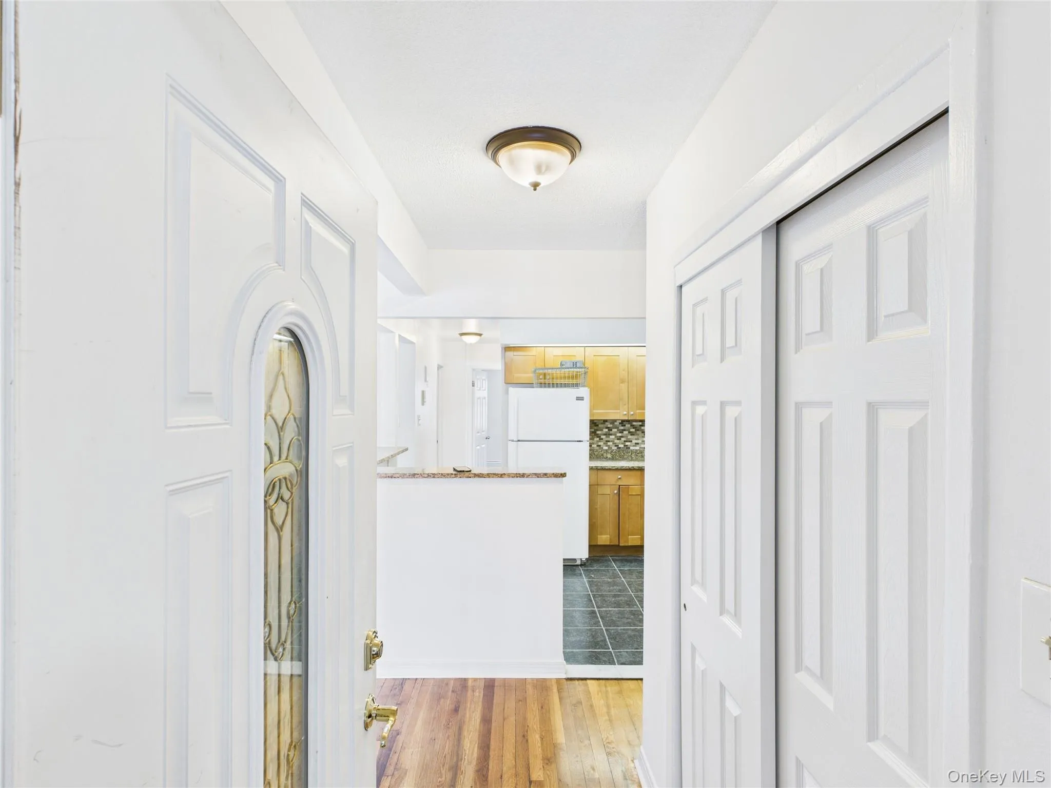 Hallway with dark wood finished floors Hallway with dark wood finished floors