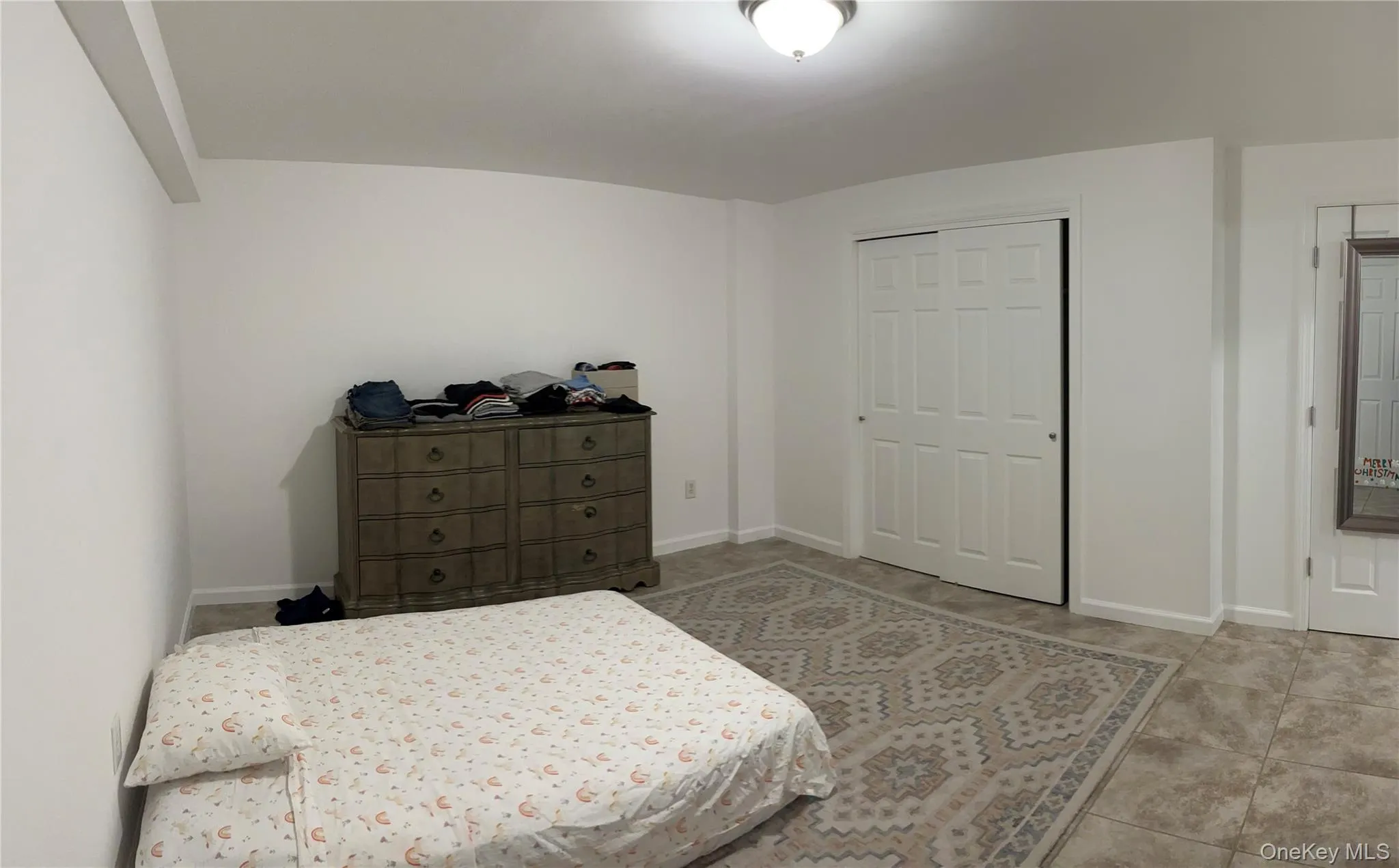 Bedroom featuring a closet and baseboards Bedroom featuring a closet and baseboards