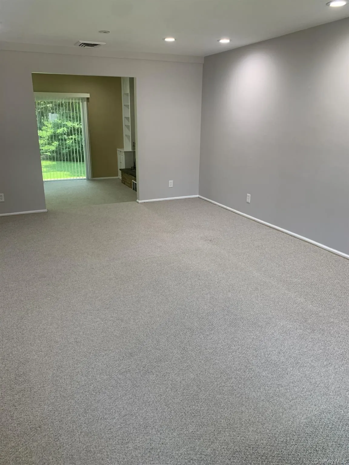 Livingroom featuring carpet floors and recessed lighting Livingroom featuring carpet floors and recessed lighting