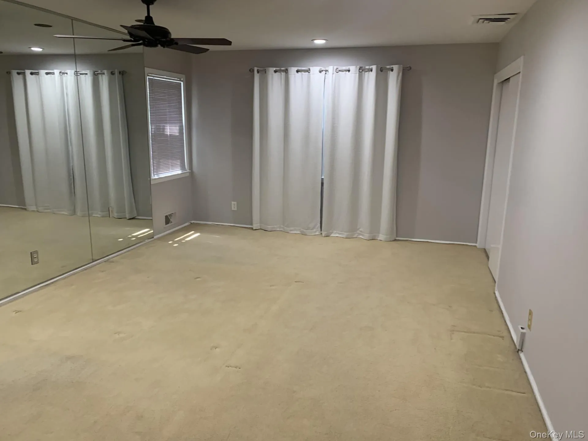 Primary bedroom with carpet, ceiling fan, Bath and recessed lighting Primary bedroom with carpet, ceiling fan, Bath and recessed lighting