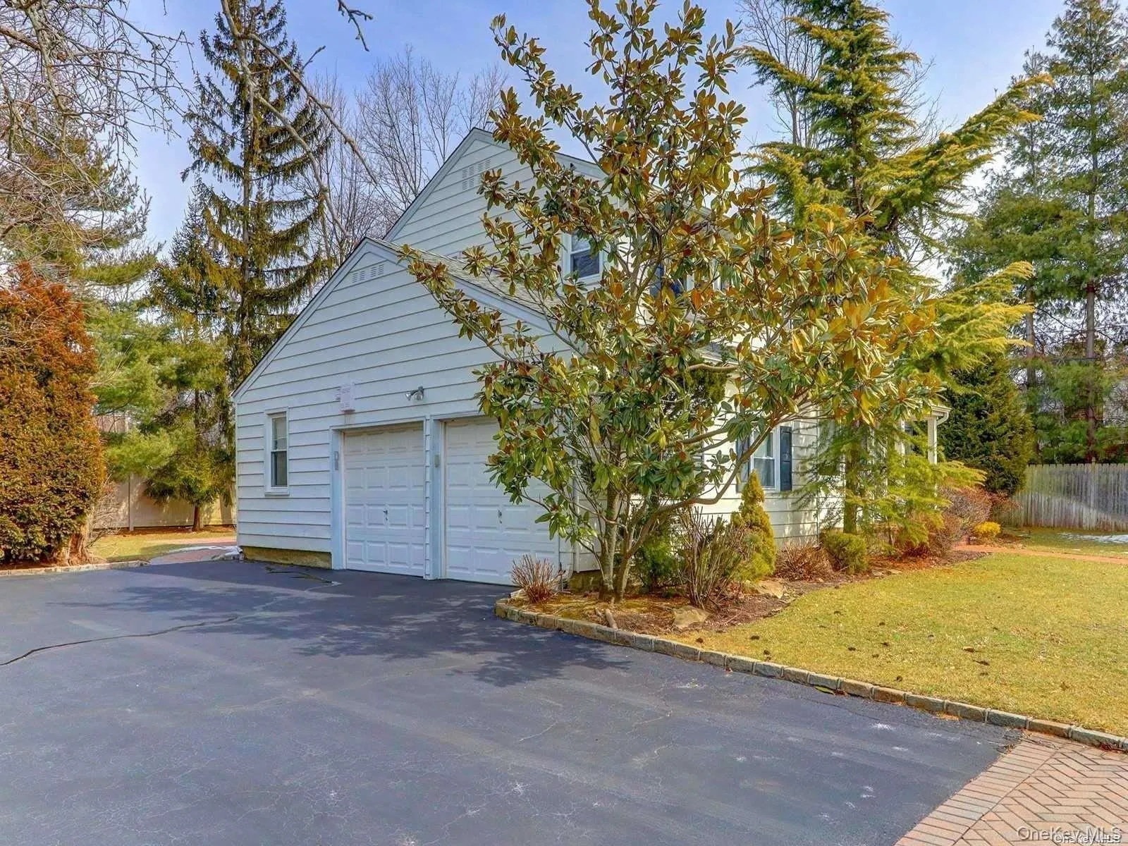 View of home's exterior with a garage and driveway View of home's exterior with a garage and driveway