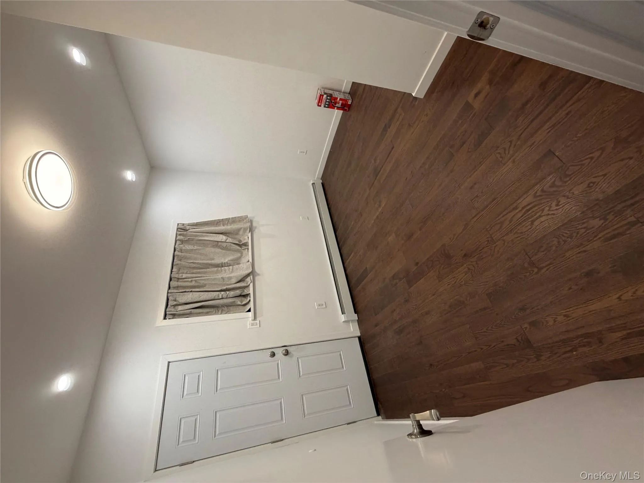 Spare room with baseboard heating, dark wood-style floors, and recessed lighting Spare room with baseboard heating, dark wood-style floors, and recessed lighting