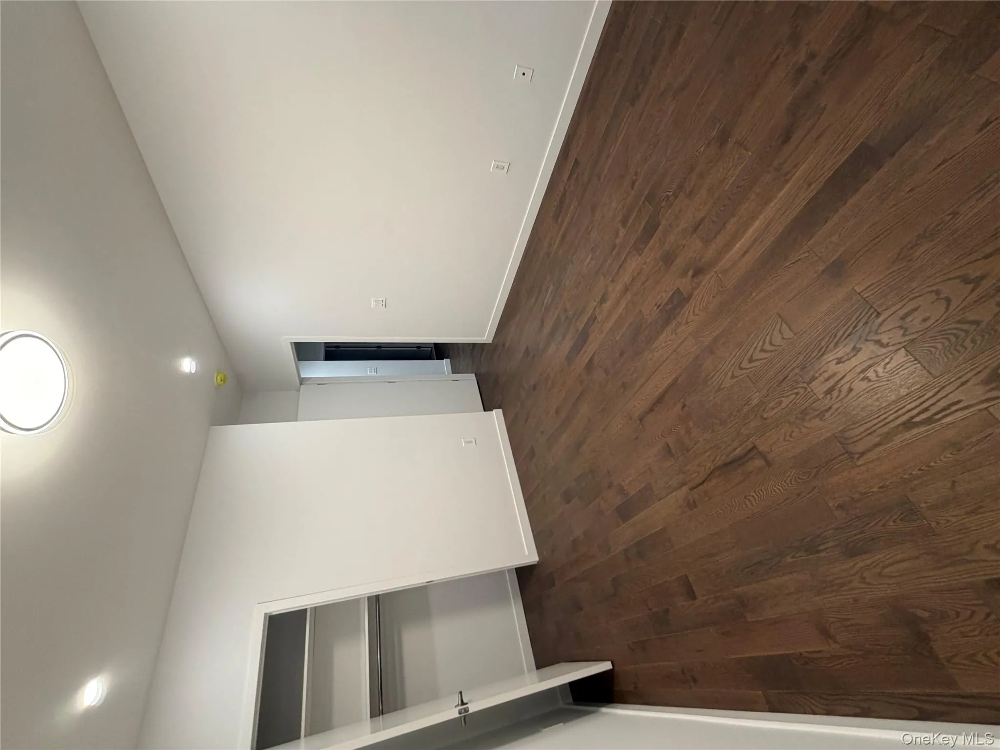 Unfurnished bedroom with dark wood finished floors, recessed lighting, and a closet Unfurnished bedroom with dark wood finished floors, recessed lighting, and a closet