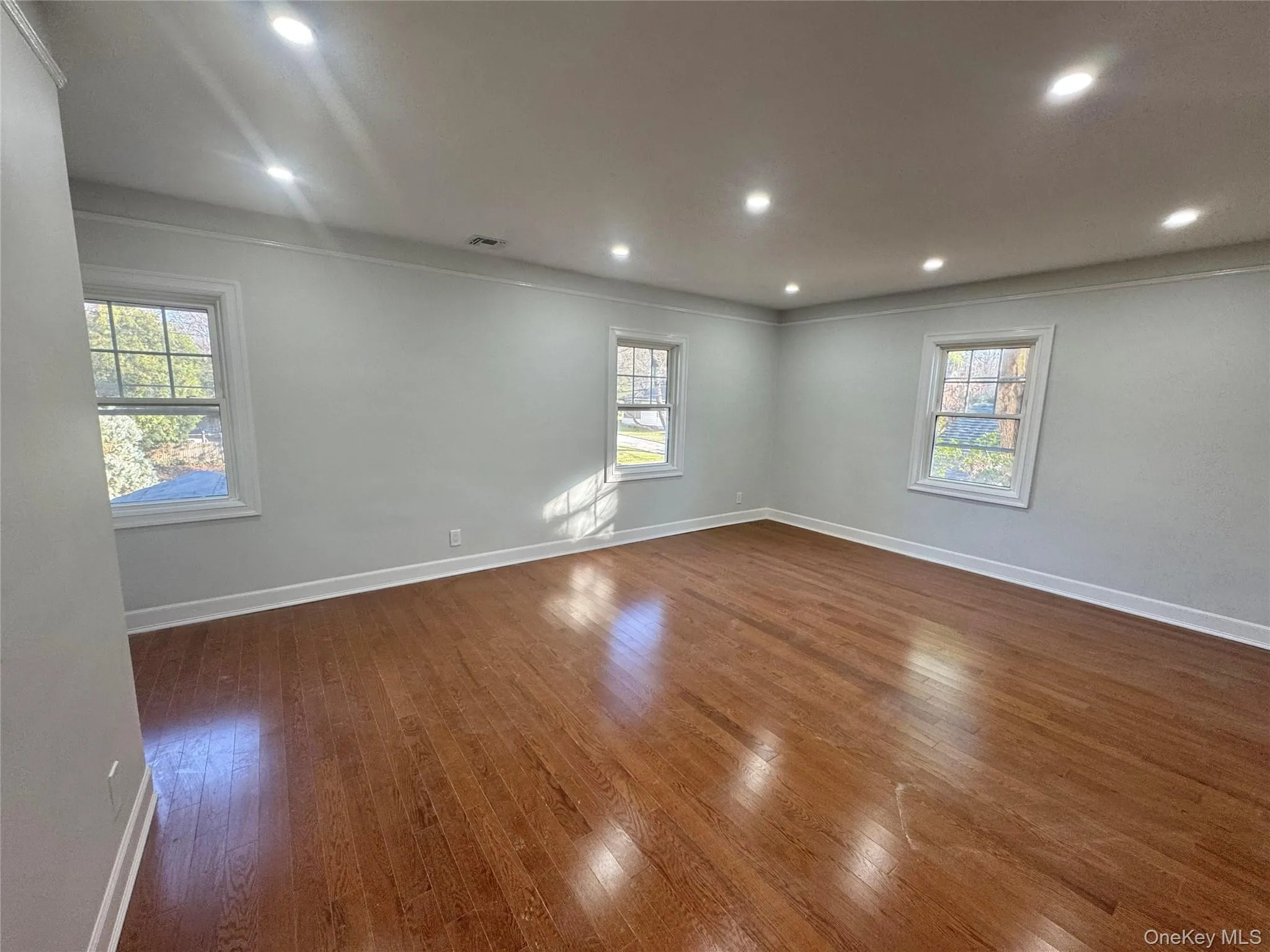 Primary Suite with Walking Closet and Full Bathroom featuring dark wood finished floors, recessed lighting, and crown molding Primary Suite with Walking Closet and Full Bathroom featuring dark wood finished floors, recessed lighting, and crown molding