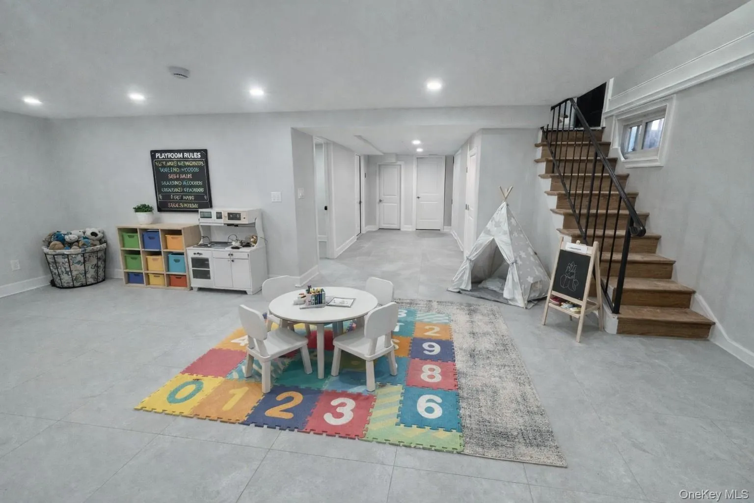 Staged Basement Playroom with concrete floors and recessed lighting Staged Basement Playroom with concrete floors and recessed lighting