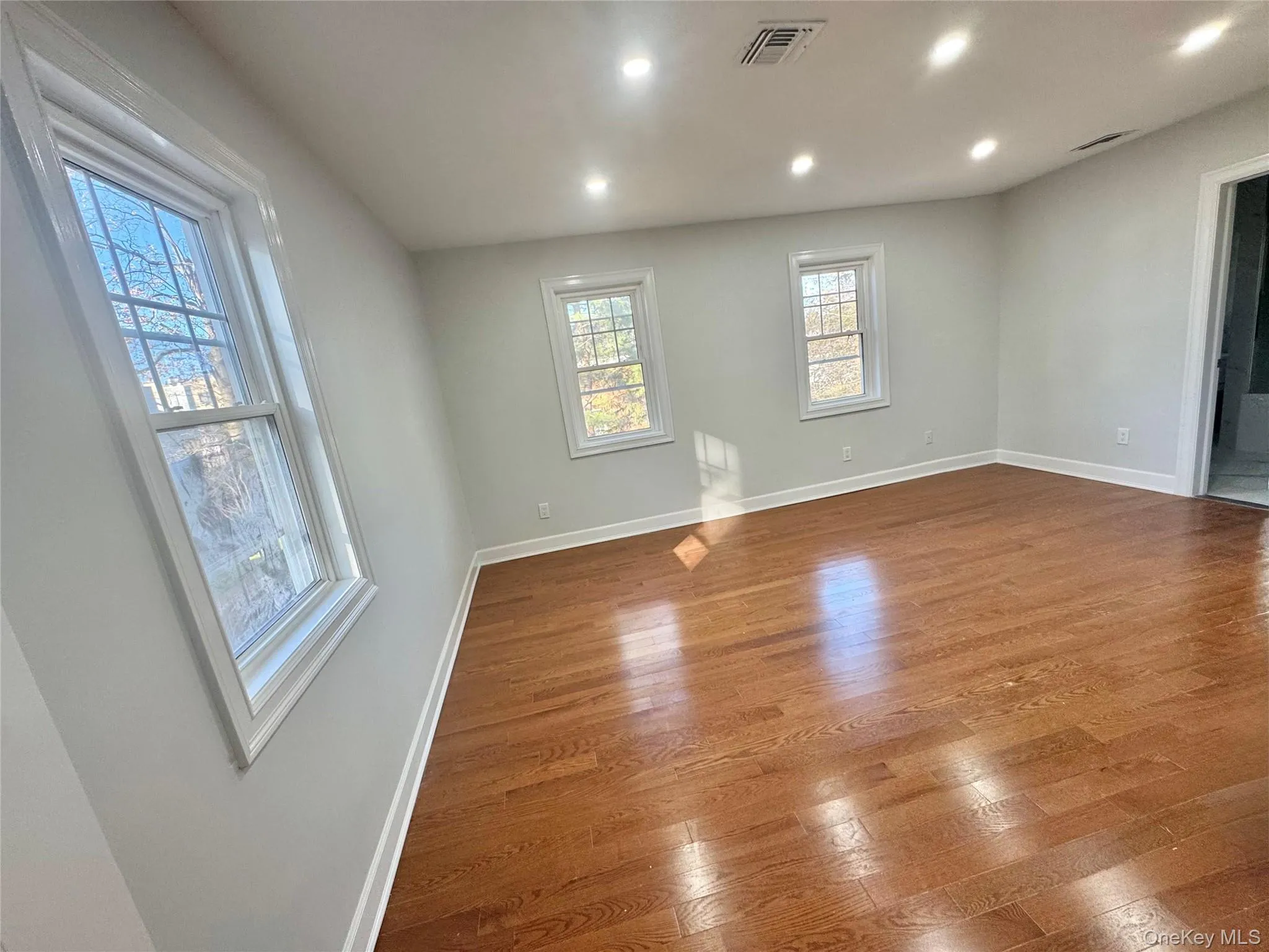 Fourth Bedroom with wood finished floors and recessed lighting Fourth Bedroom with wood finished floors and recessed lighting