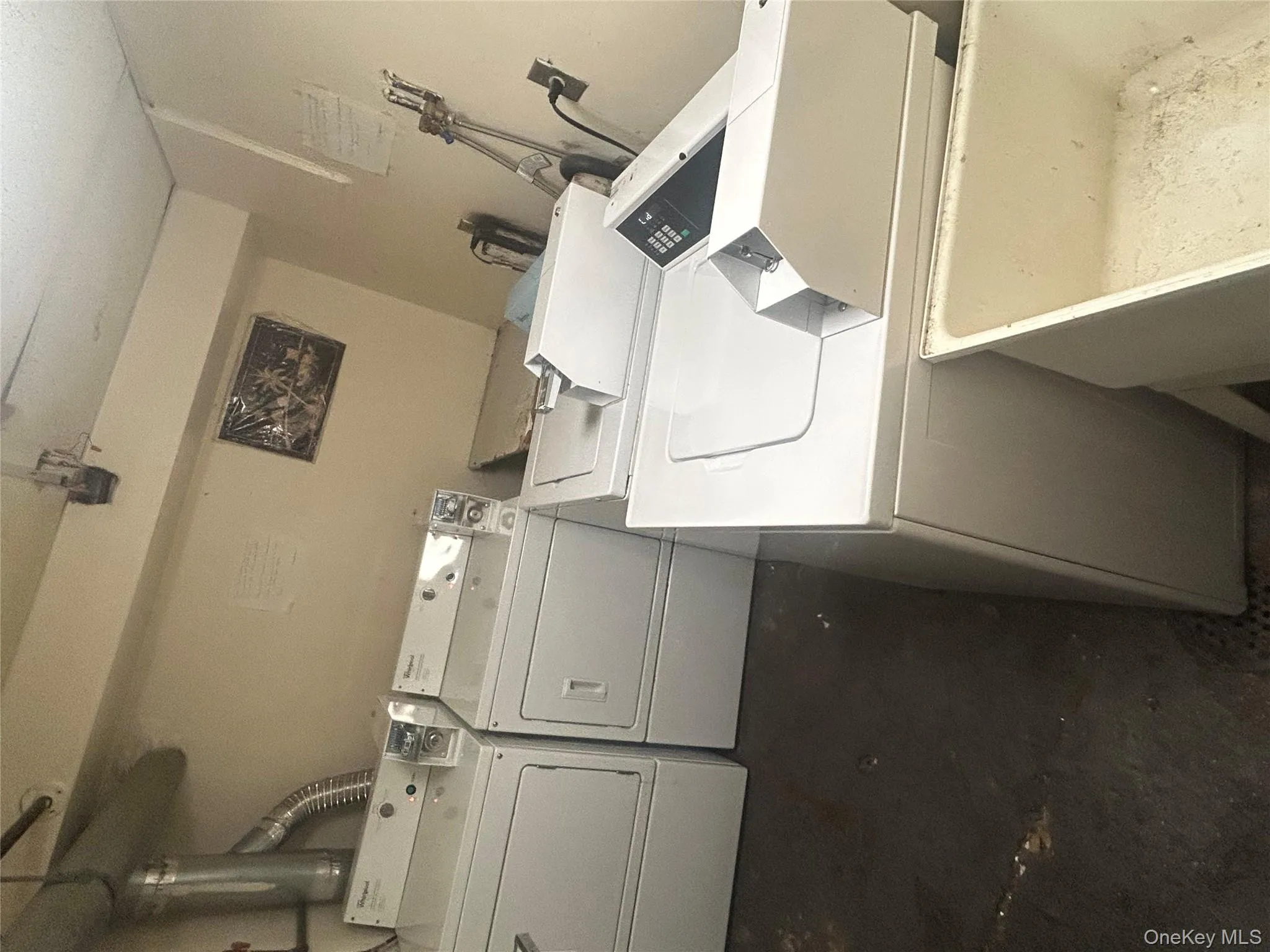 Shared laundry room featuring washer and dryer Shared laundry room featuring washer and dryer