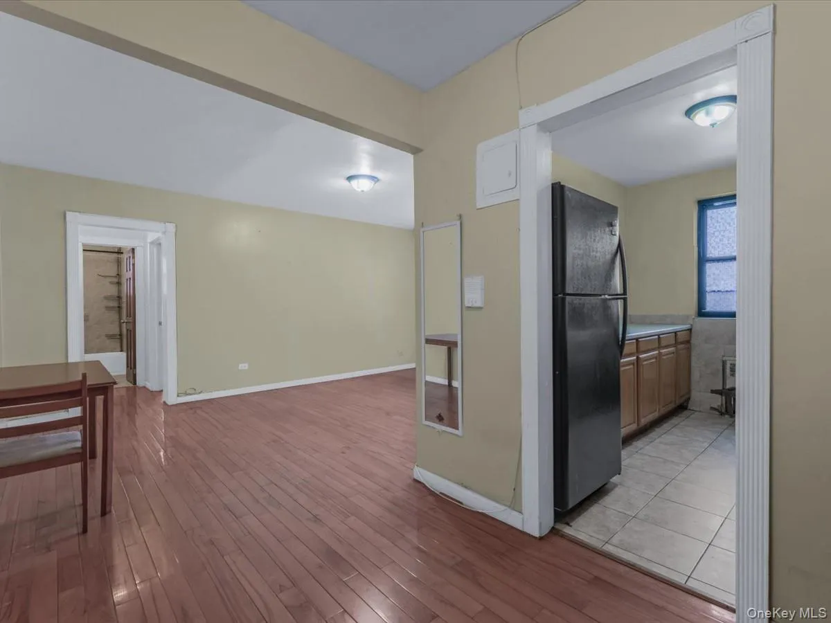 Hallway with light wood-type flooring and baseboards Hallway with light wood-type flooring and baseboards