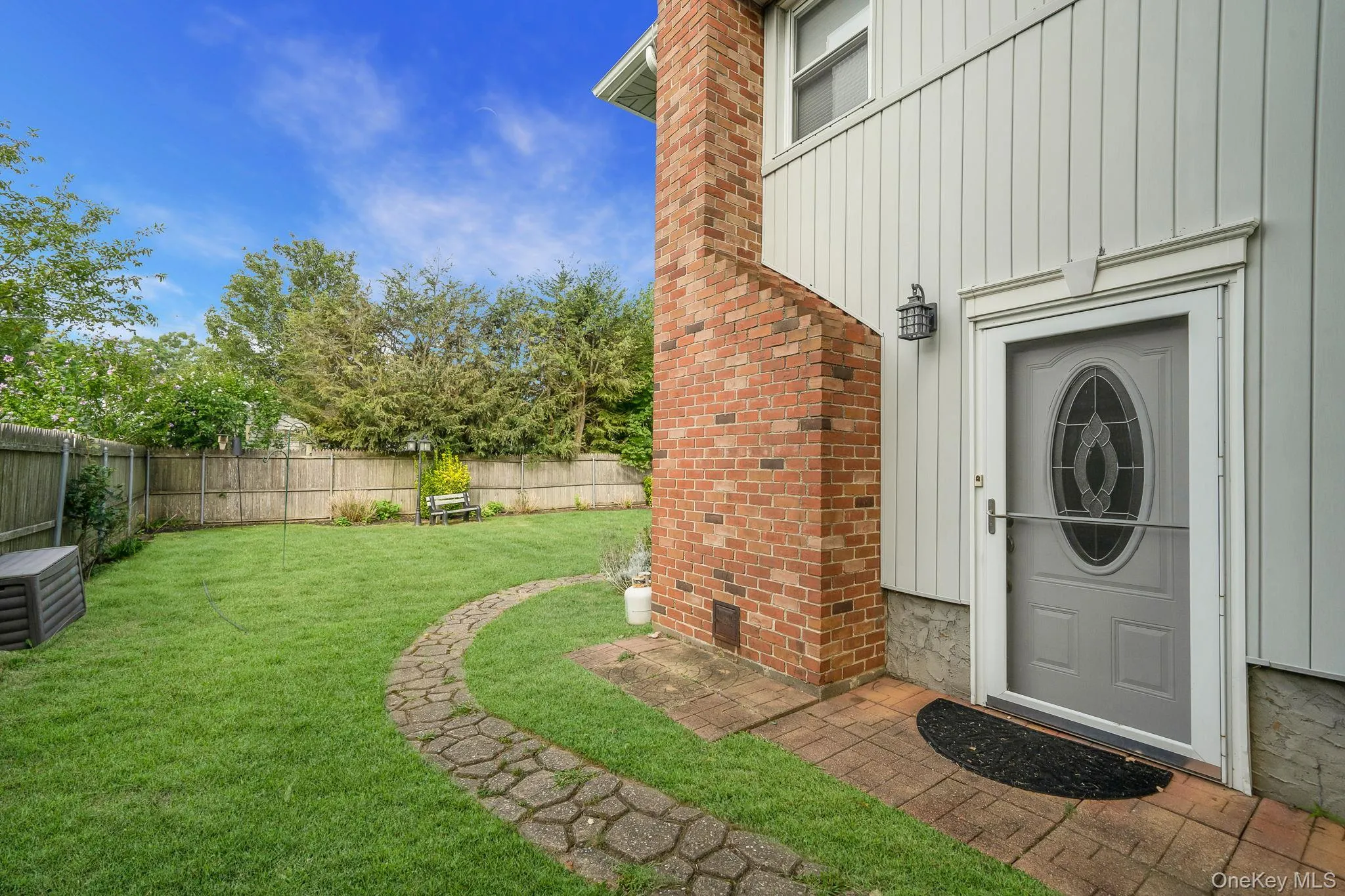 Property entrance with board and batten siding Property entrance with board and batten siding