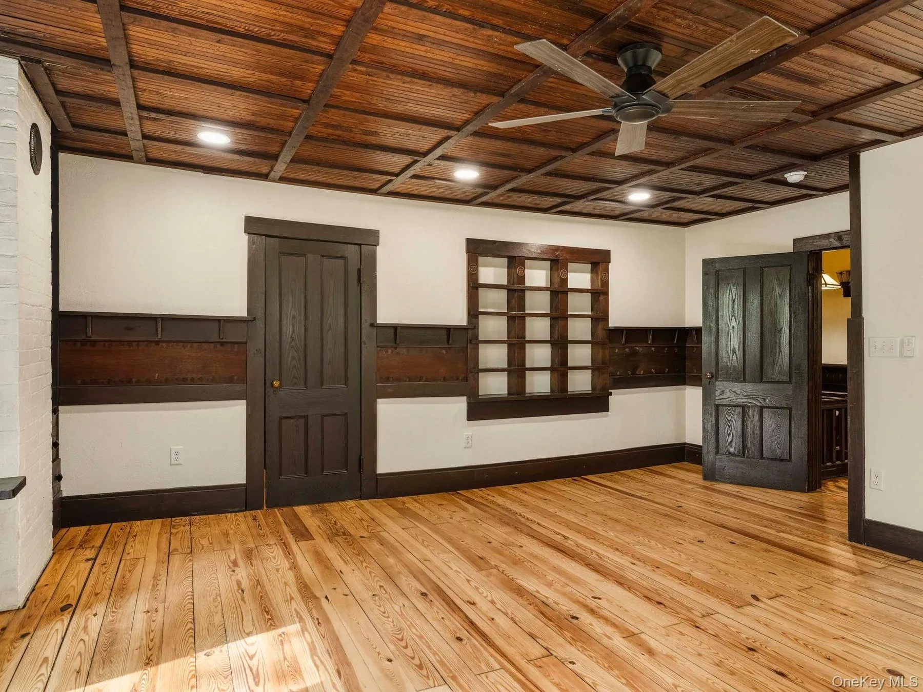 Spare room with wooden ceiling, light wood finished floors, and ceiling fan Spare room with wooden ceiling, light wood finished floors, and ceiling fan