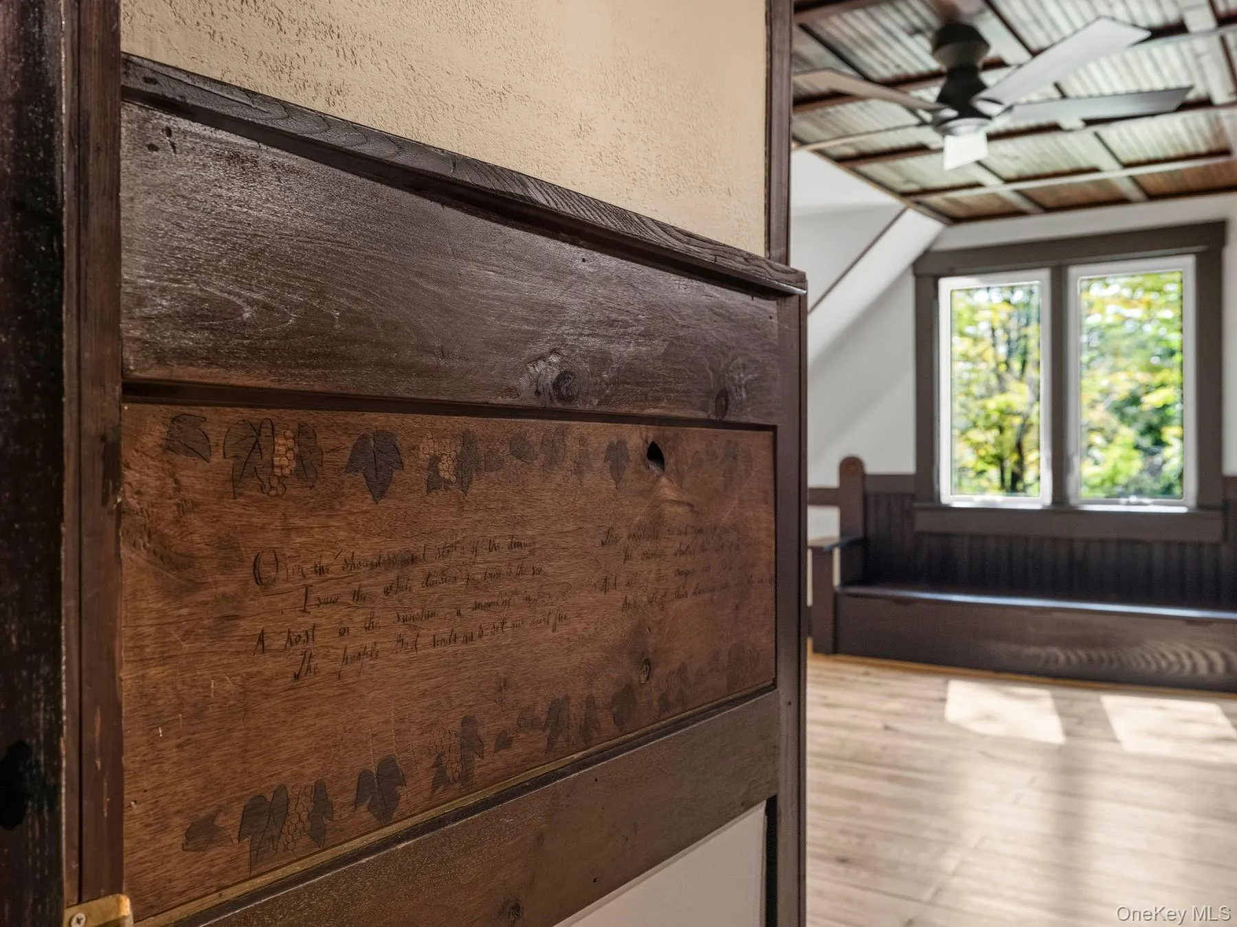 Detailed view of ceiling fan and wood finished floors Detailed view of ceiling fan and wood finished floors