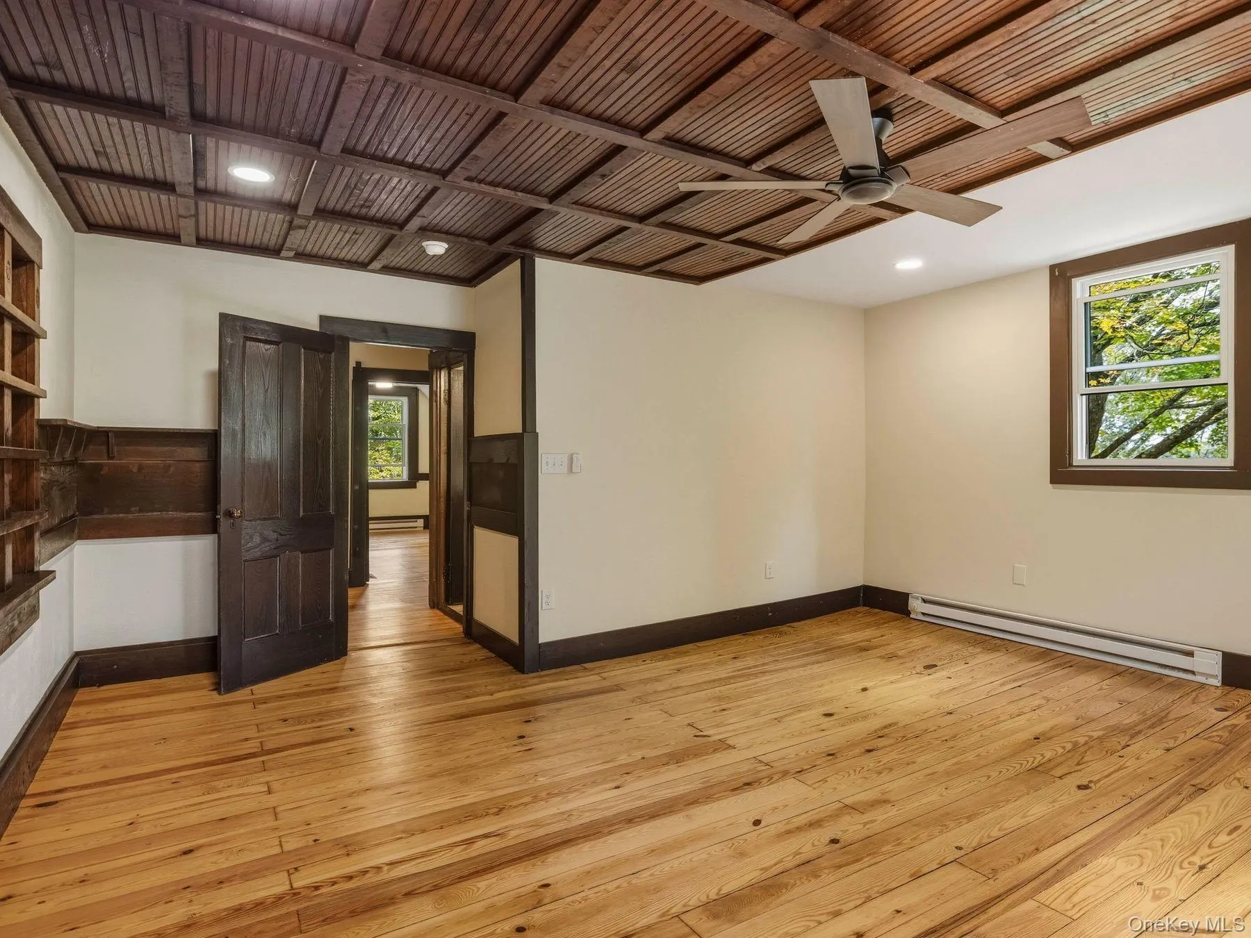 Unfurnished room featuring a baseboard radiator, light wood finished floors, a ceiling fan, recessed lighting, and wood ceiling Unfurnished room featuring a baseboard radiator, light wood finished floors, a ceiling fan, recessed lighting, and wood ceiling