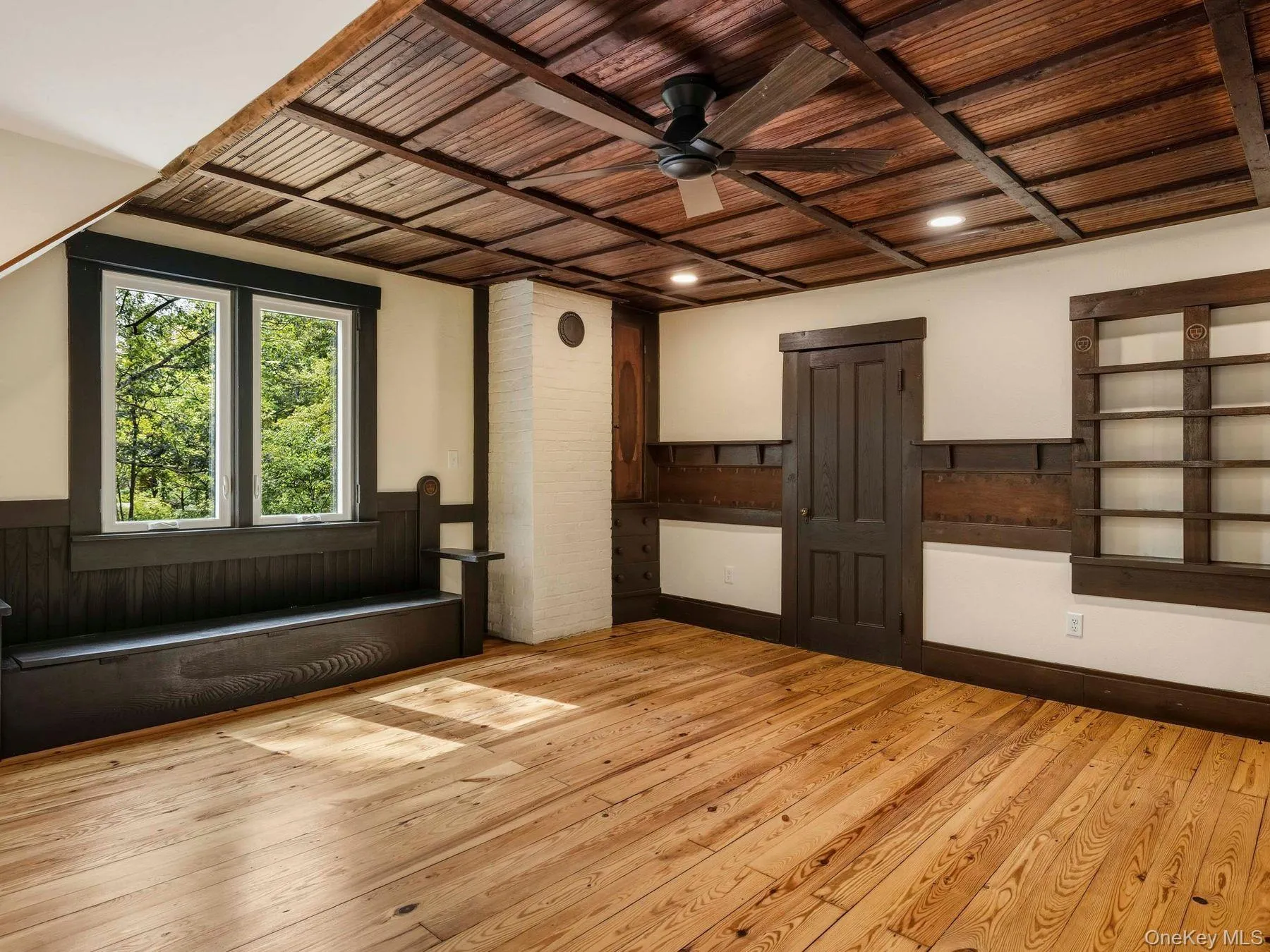 Spare room with wood ceiling, a ceiling fan, light wood-type flooring, and a wainscoted wall Spare room with wood ceiling, a ceiling fan, light wood-type flooring, and a wainscoted wall