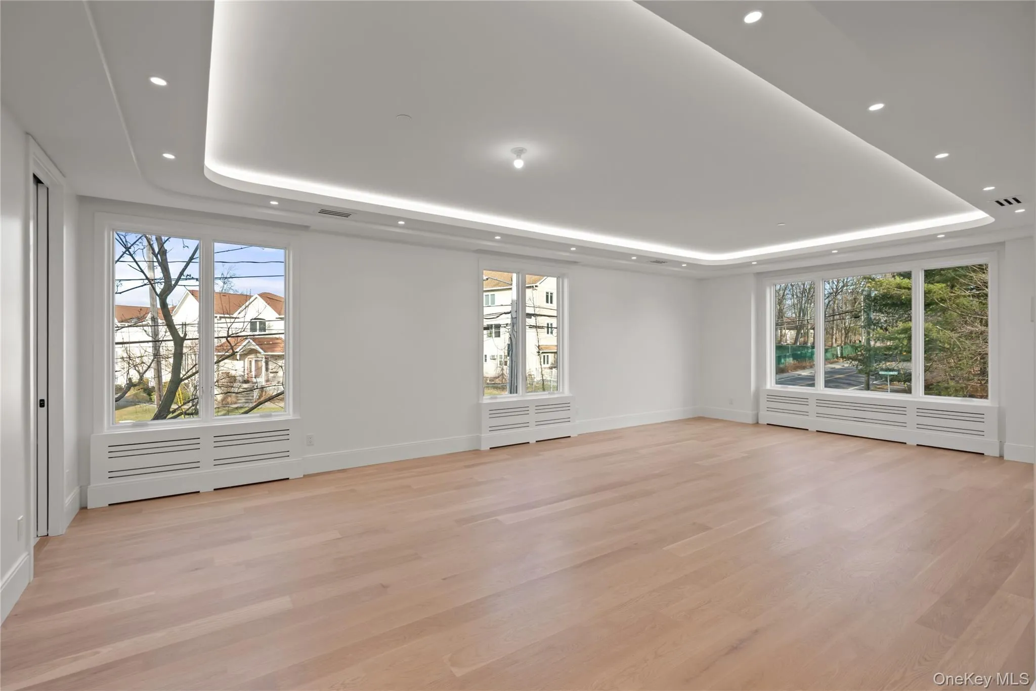 Oversized dining room/ living room featuring LED tray ceilings Oversized dining room/ living room featuring LED tray ceilings