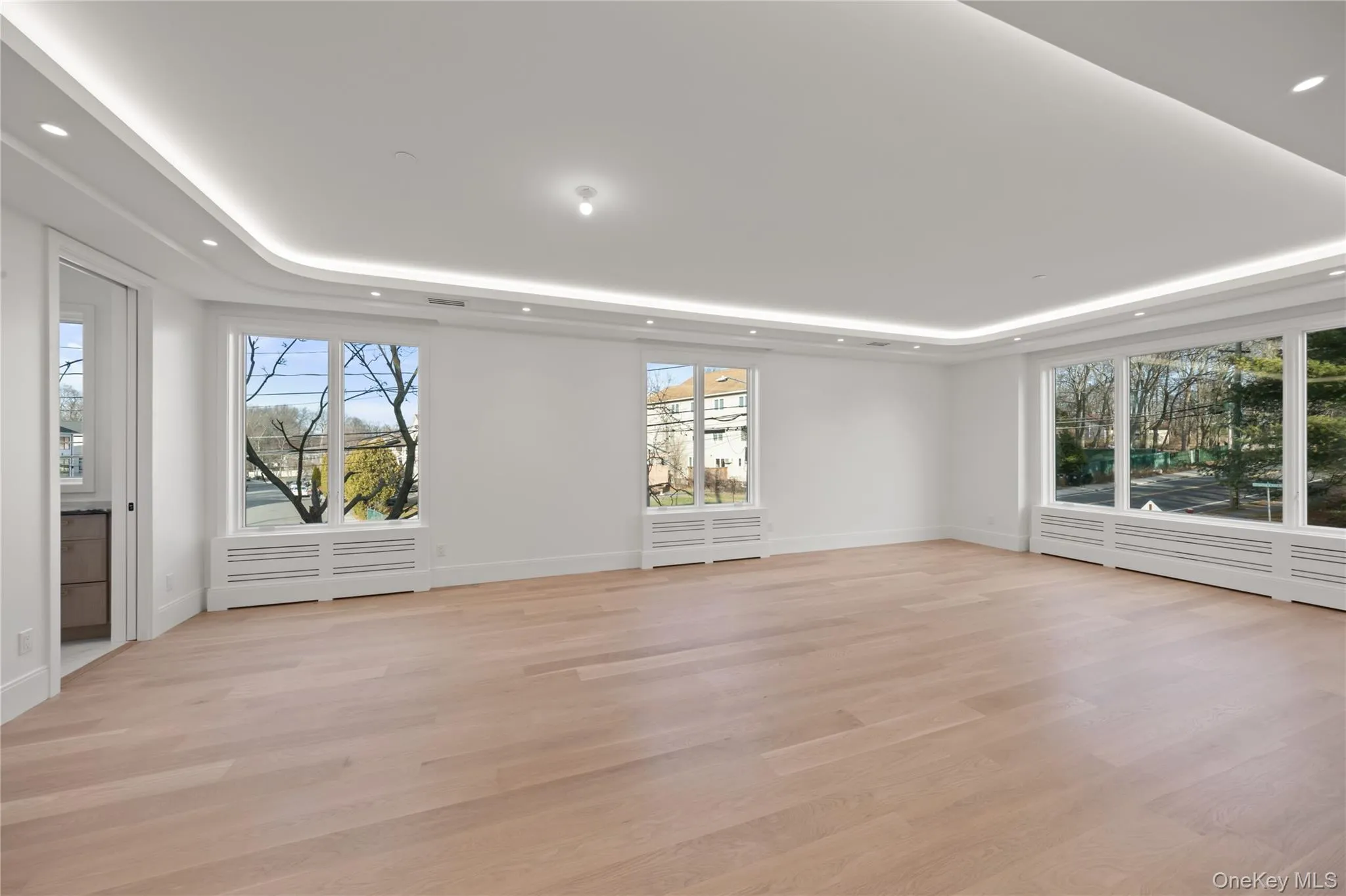 Oversized dining room/ living room featuring LED tray ceilings Oversized dining room/ living room featuring LED tray ceilings