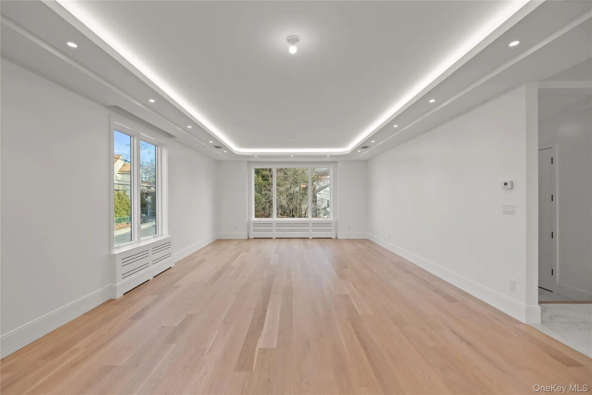 Oversized dining room/ living room featuring LED tray ceilings Oversized dining room/ living room featuring LED tray ceilings