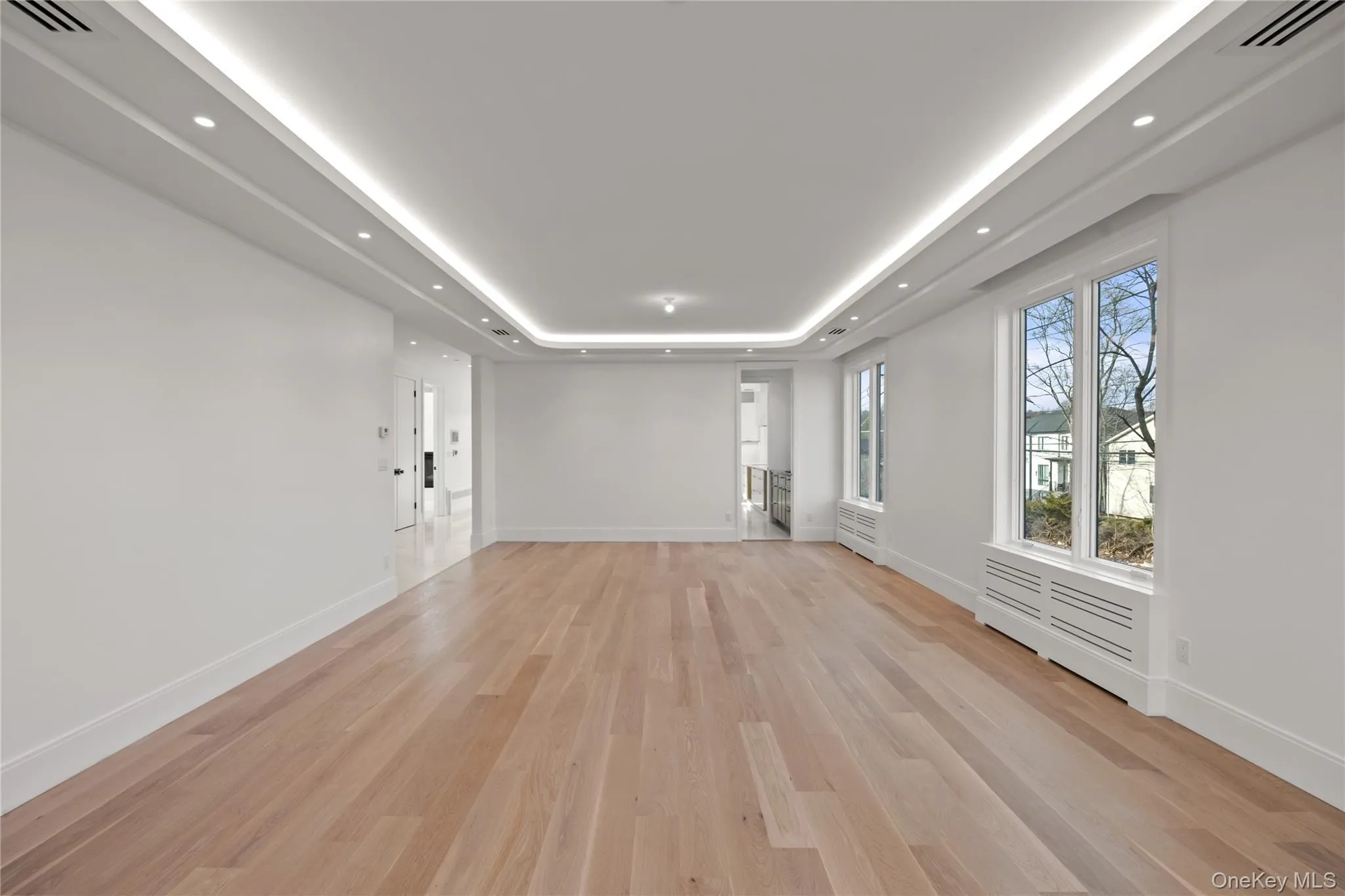 Oversized dining room/ living room featuring LED tray ceilings Oversized dining room/ living room featuring LED tray ceilings