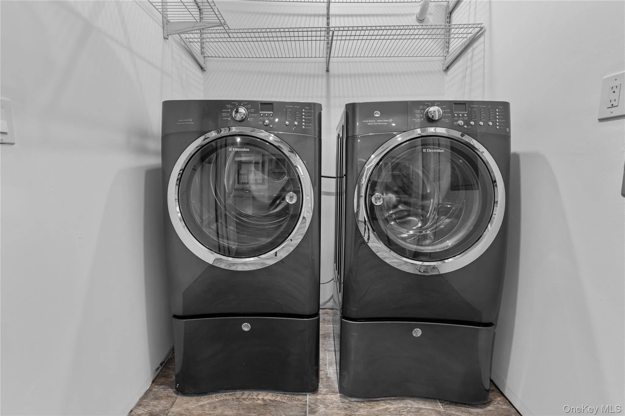 Washroom with washer and clothes dryer Washroom with washer and clothes dryer