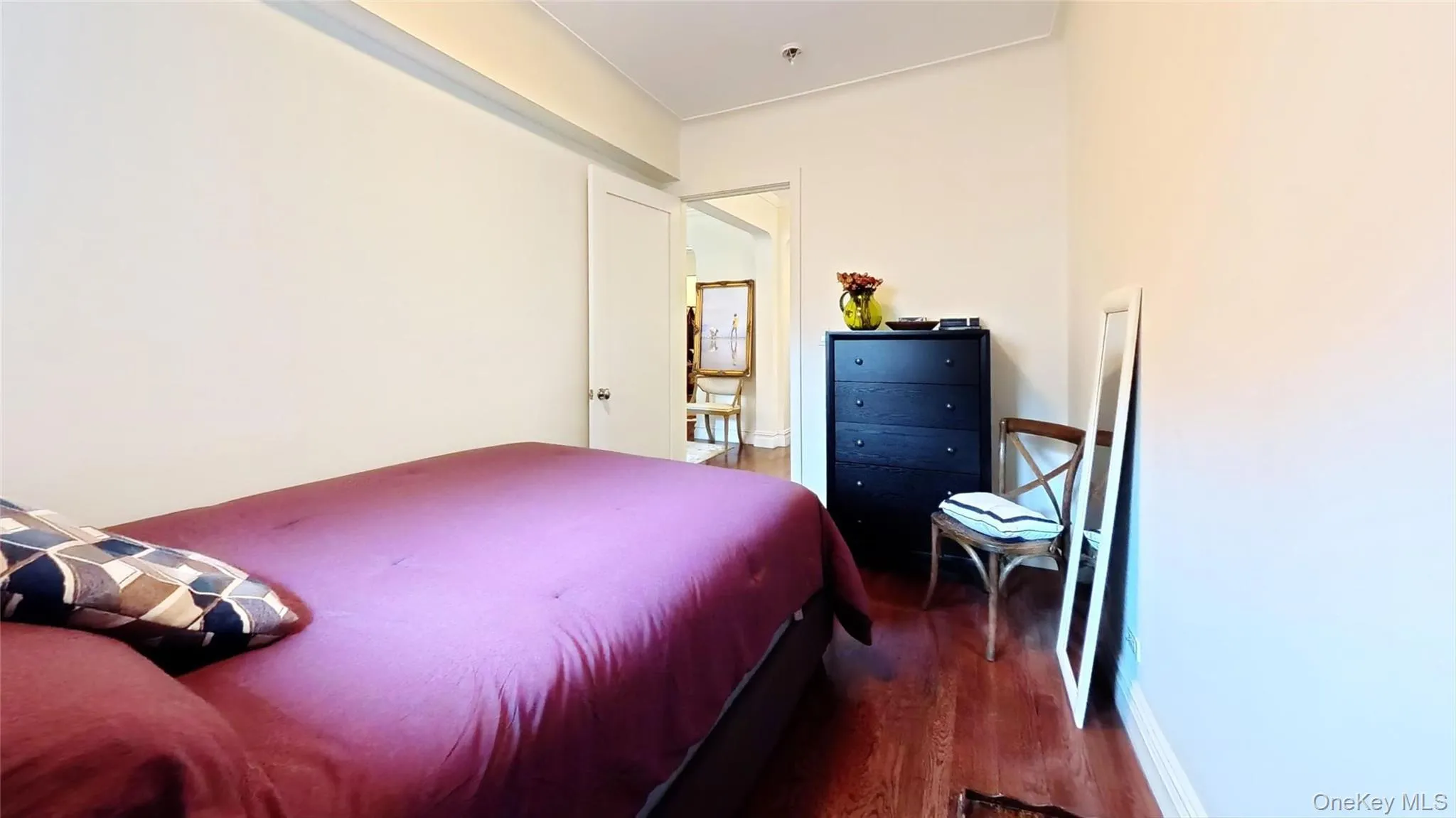 Bedroom featuring wood finished floors Bedroom featuring wood finished floors