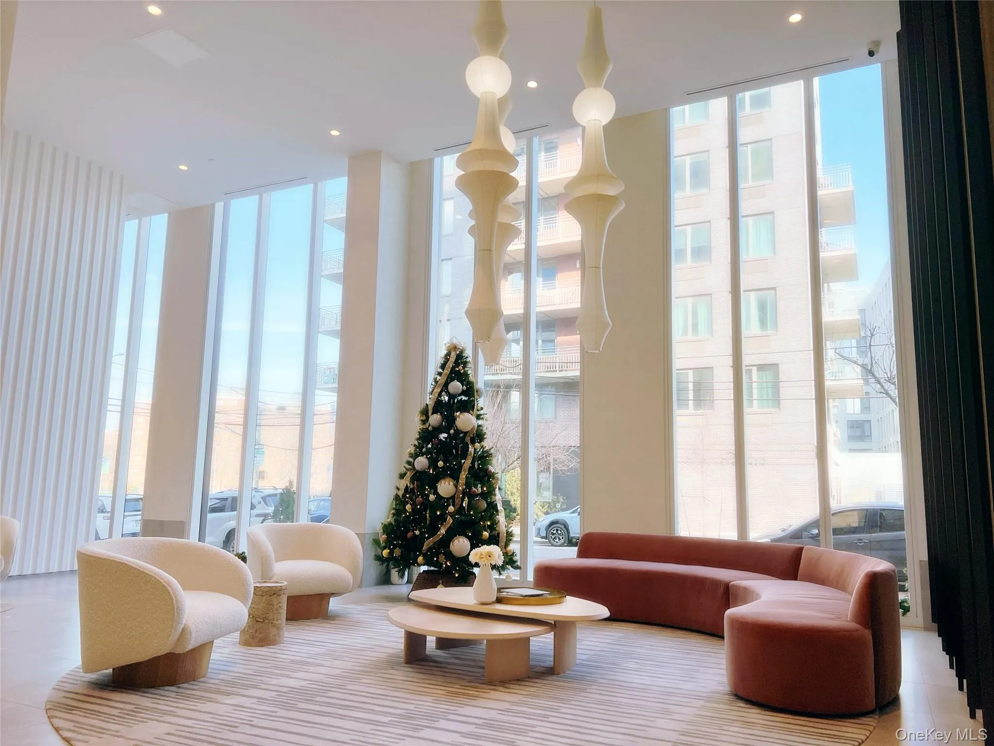 Lobby with expansive windows and recessed lighting Lobby with expansive windows and recessed lighting