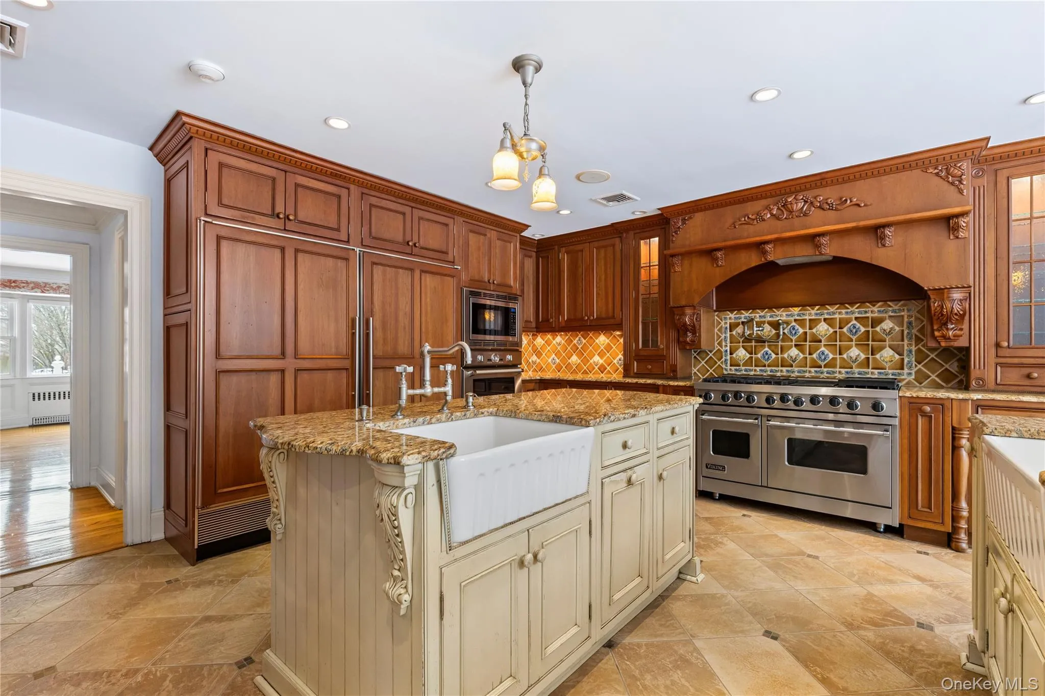 Another view of chef's kitchen - features full-size refrigerator & freezer, oven/stove Another view of chef's kitchen - features full-size refrigerator & freezer, oven/stove
