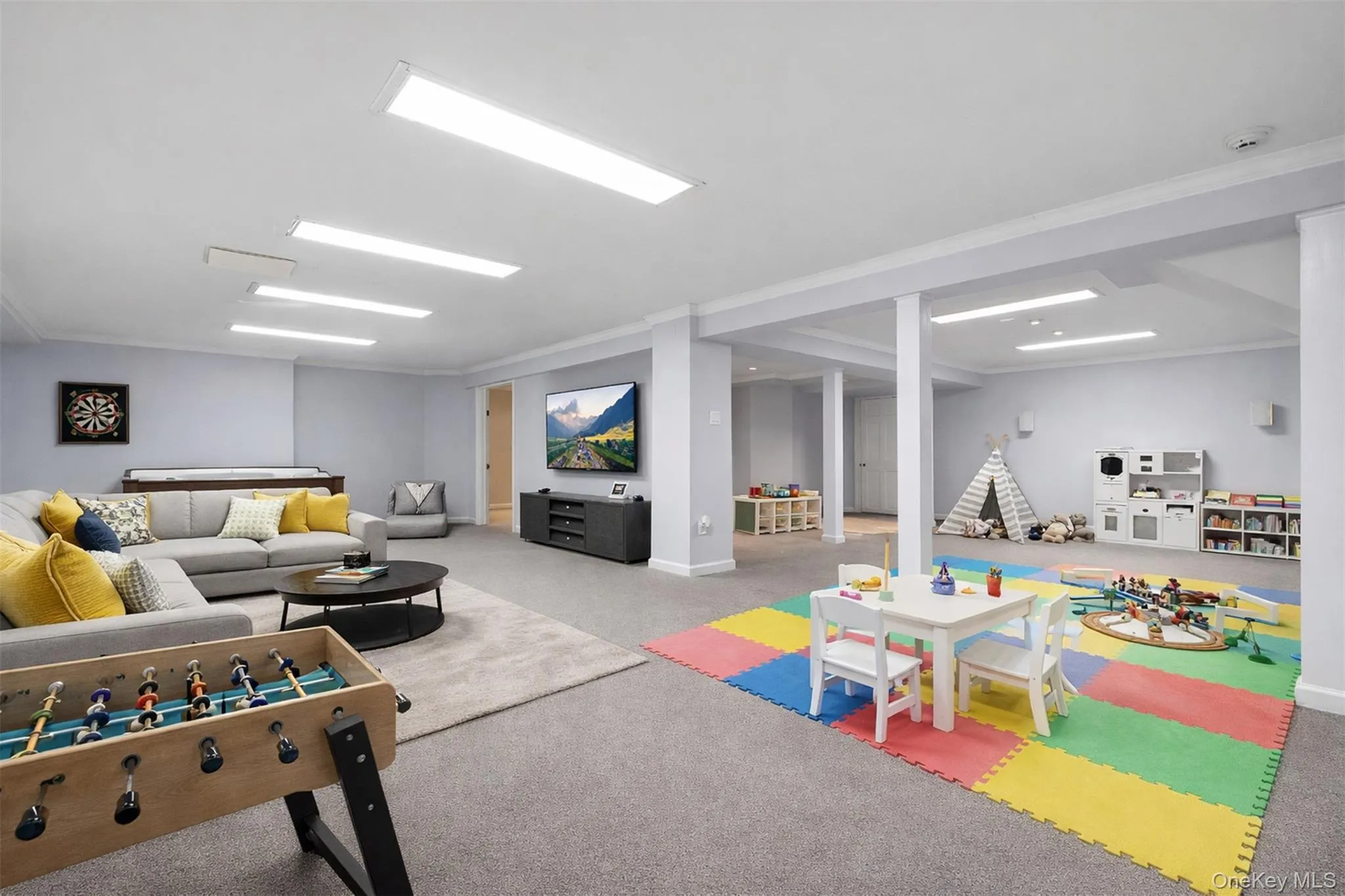 Digitally Staged: Lower level multi-use recreational space Digitally Staged: Lower level multi-use recreational space