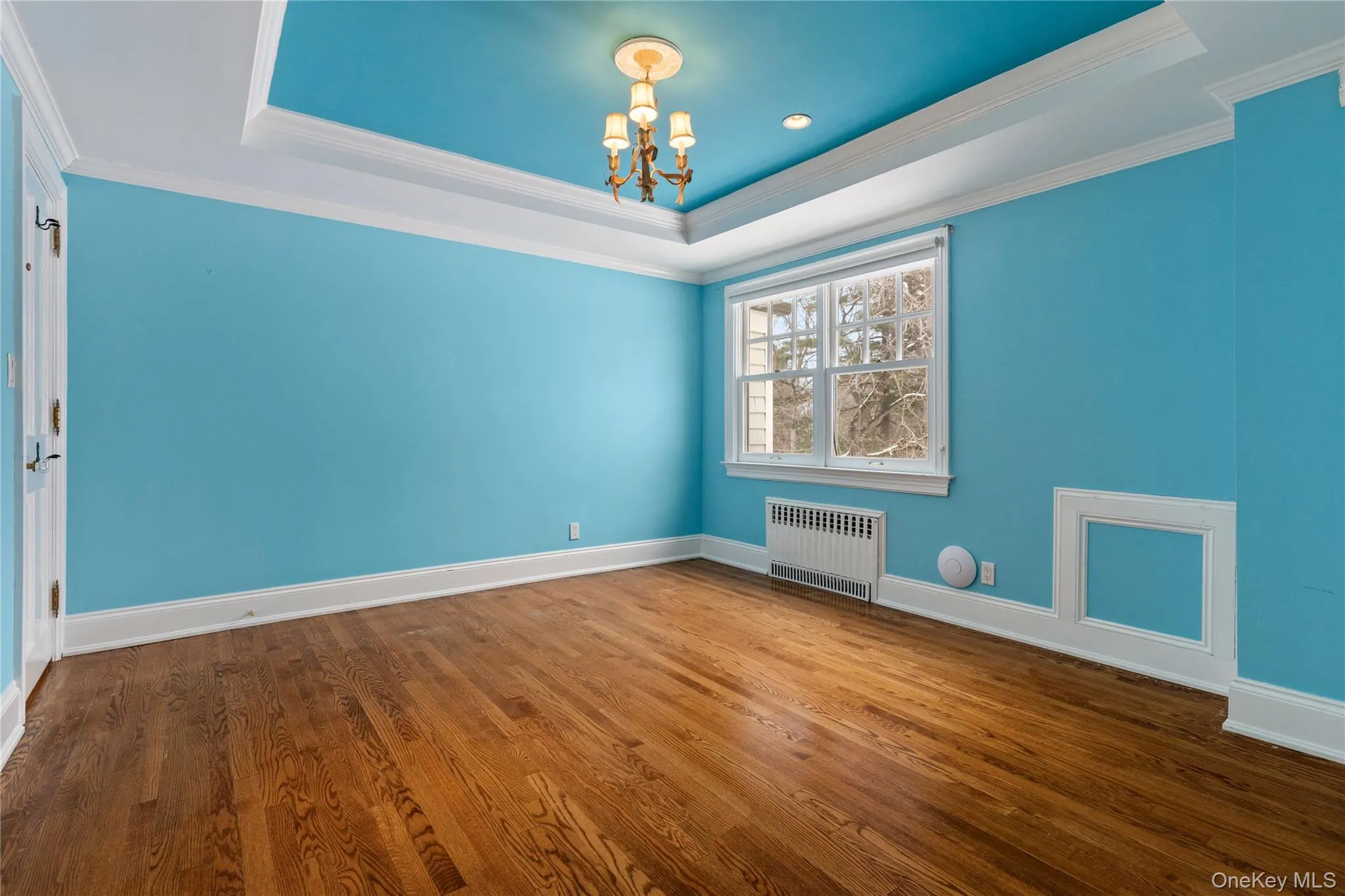 Bedroom/nursery features tray ceiling, crown molding, and HDWD floors Bedroom/nursery features tray ceiling, crown molding, and HDWD floors