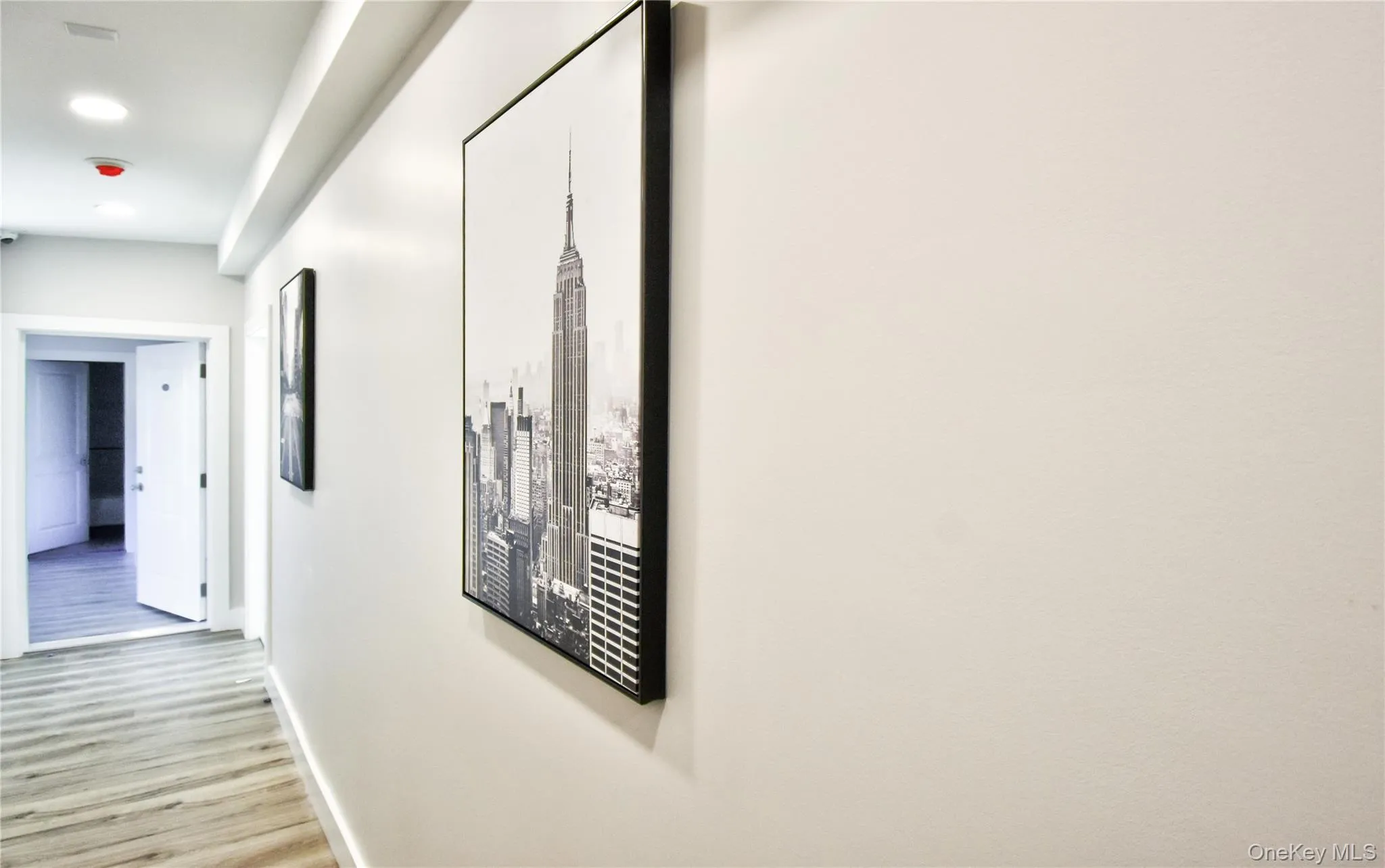 Corridor with wood finished floors and recessed lighting Corridor with wood finished floors and recessed lighting